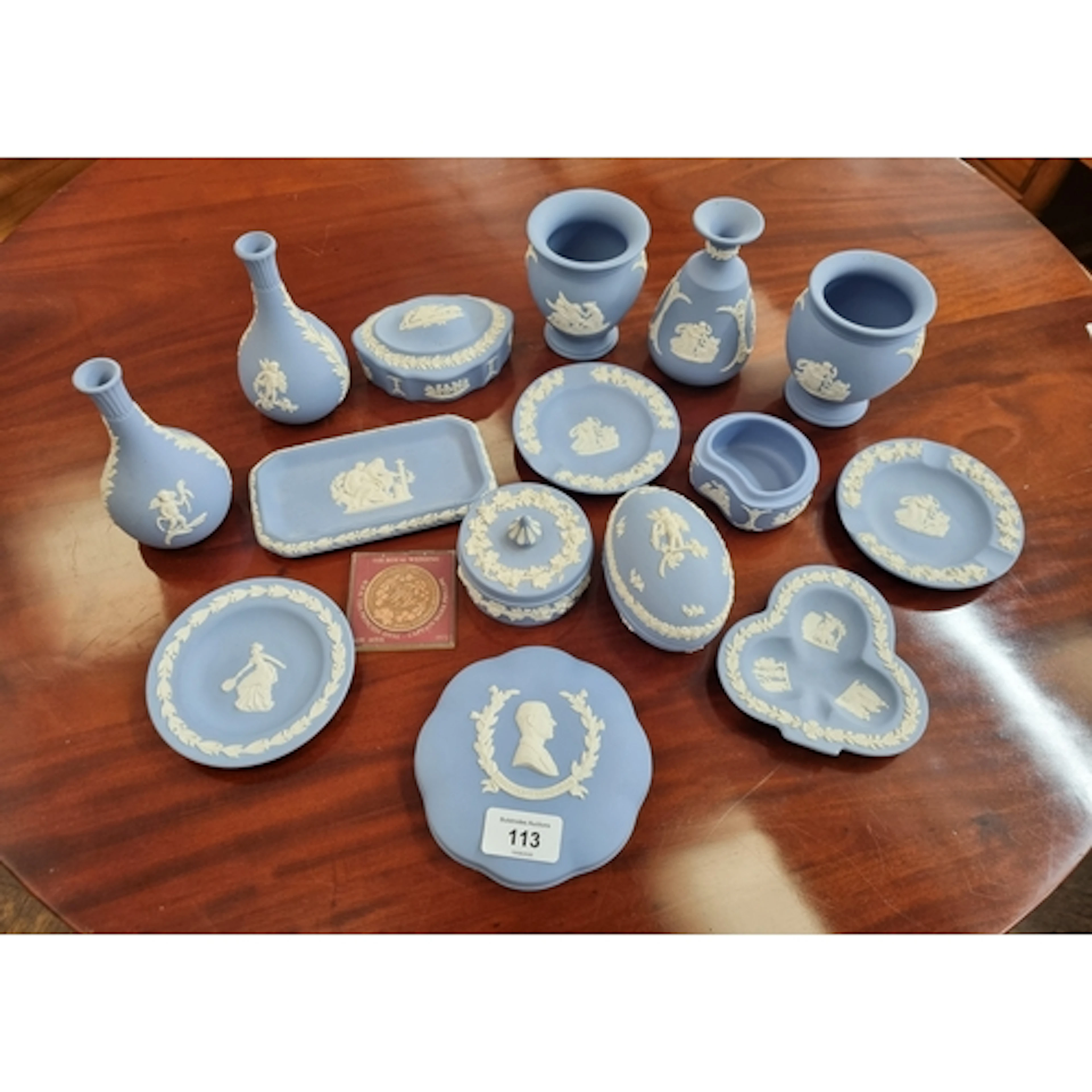 A collection of pale blue Wedgwood Jasperware and a commemor...