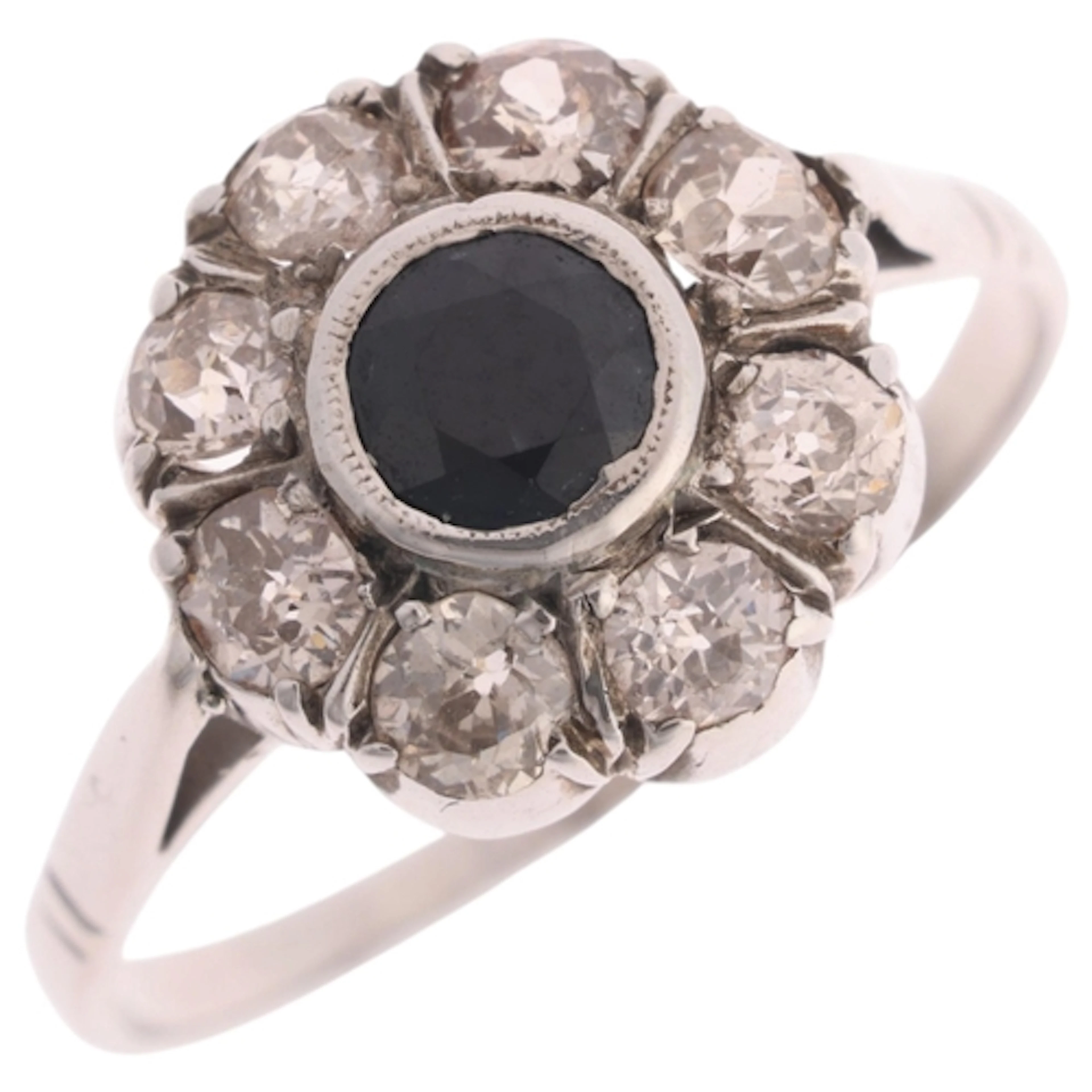 An 18ct white gold sapphire and diamond cluster ring, rub-ov...