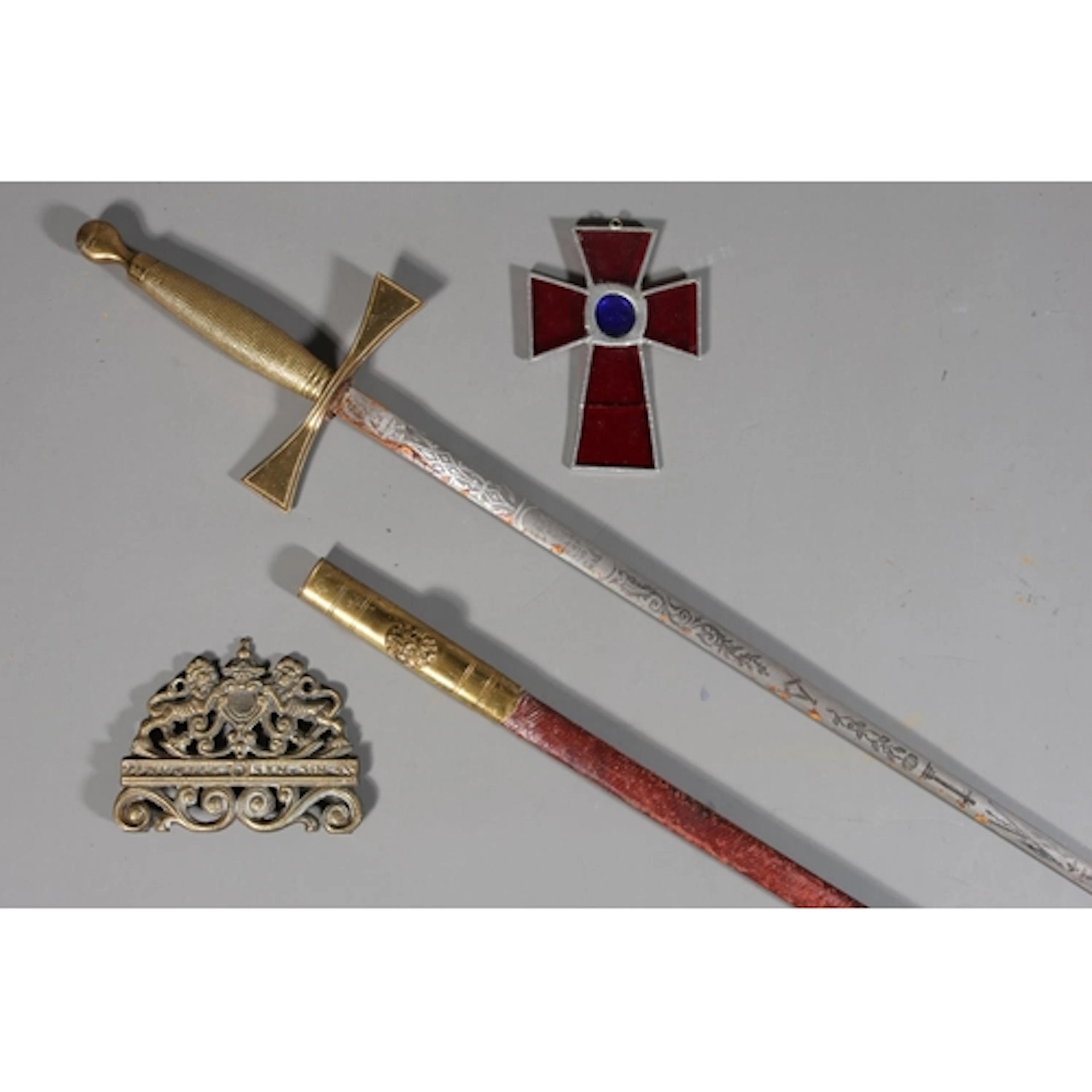 Stephen Simpson sword, a brass crest and a cruciform.