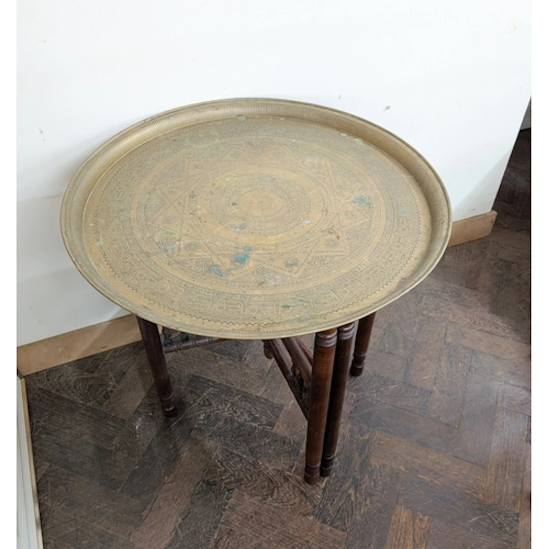 Circular brass tray topped tiffin style table on folding bas...