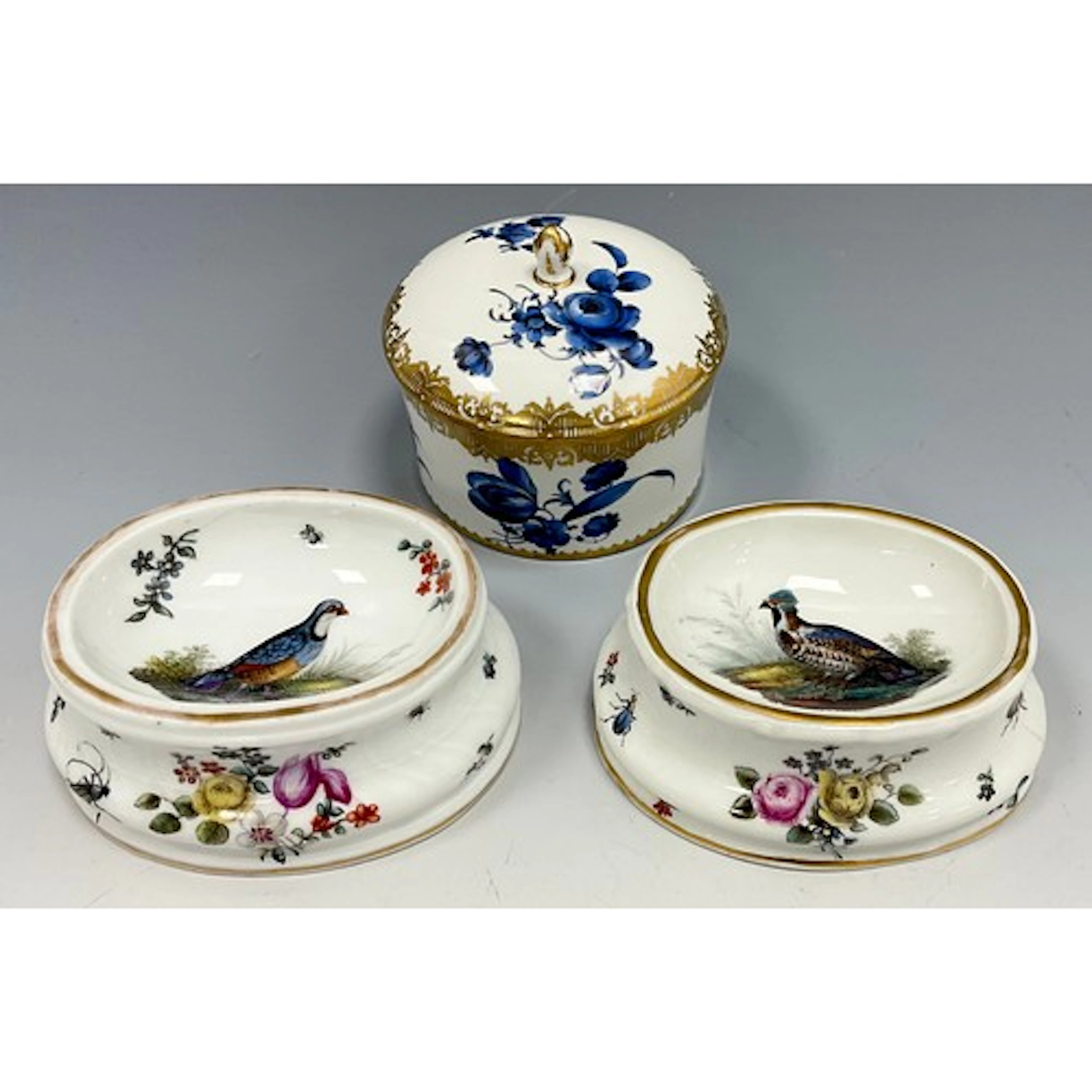 A near pair of Berlin trencher salts, decorated in polychrom...