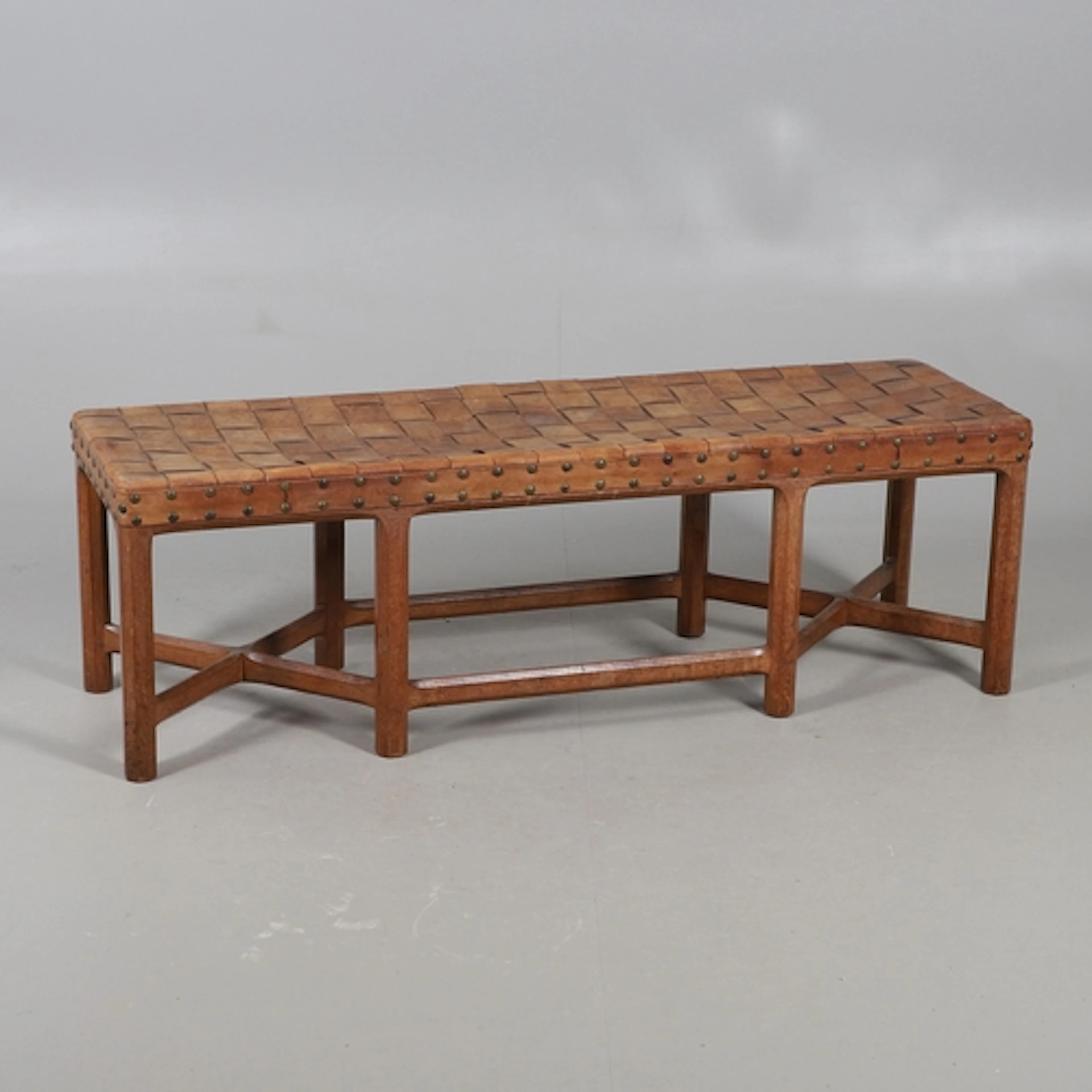 GORDON RUSSELL - LARGE COTSWOLD SCHOOL OAK STOOL. A large oa...