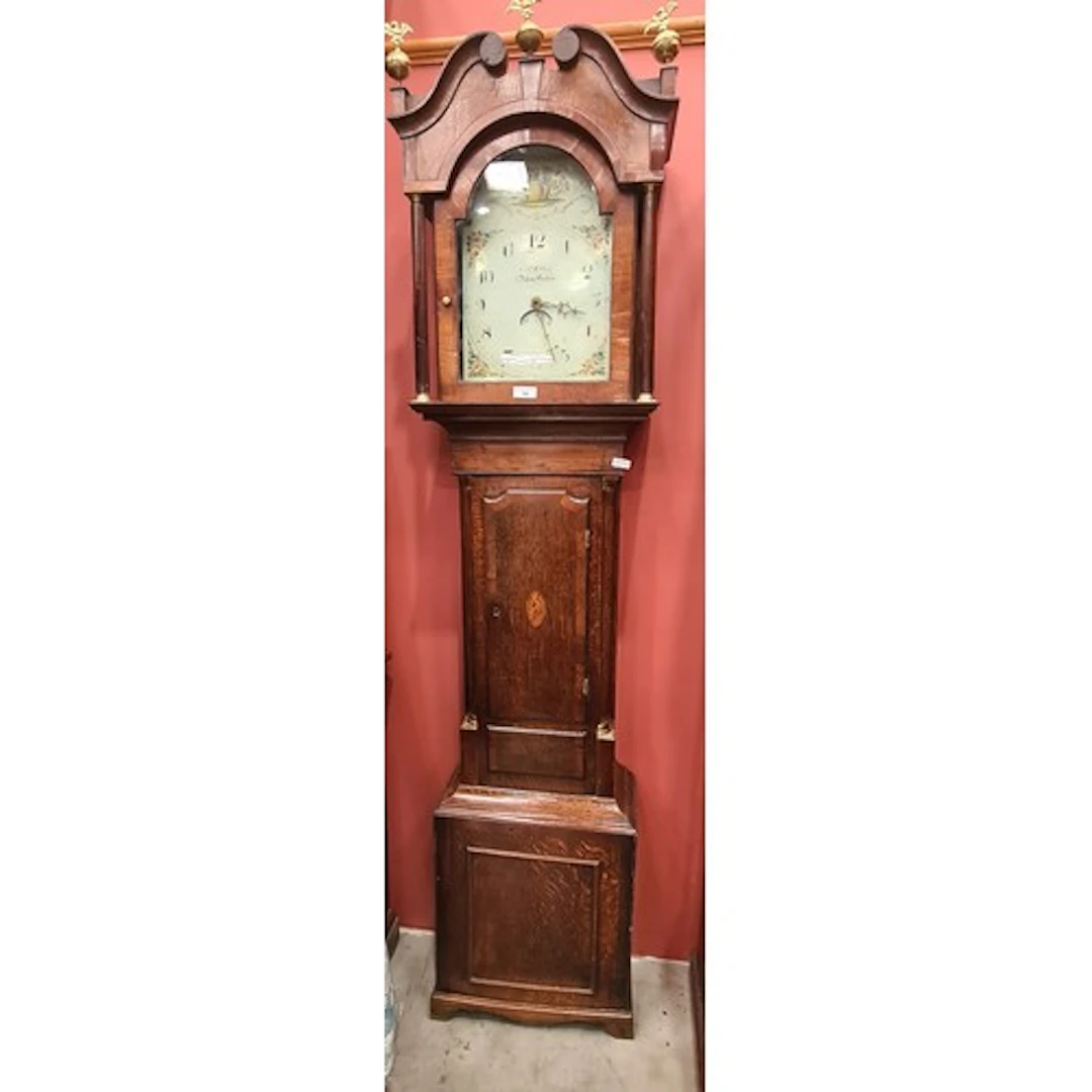 An antique oak Longcase Clock with painted arched dial inscr...