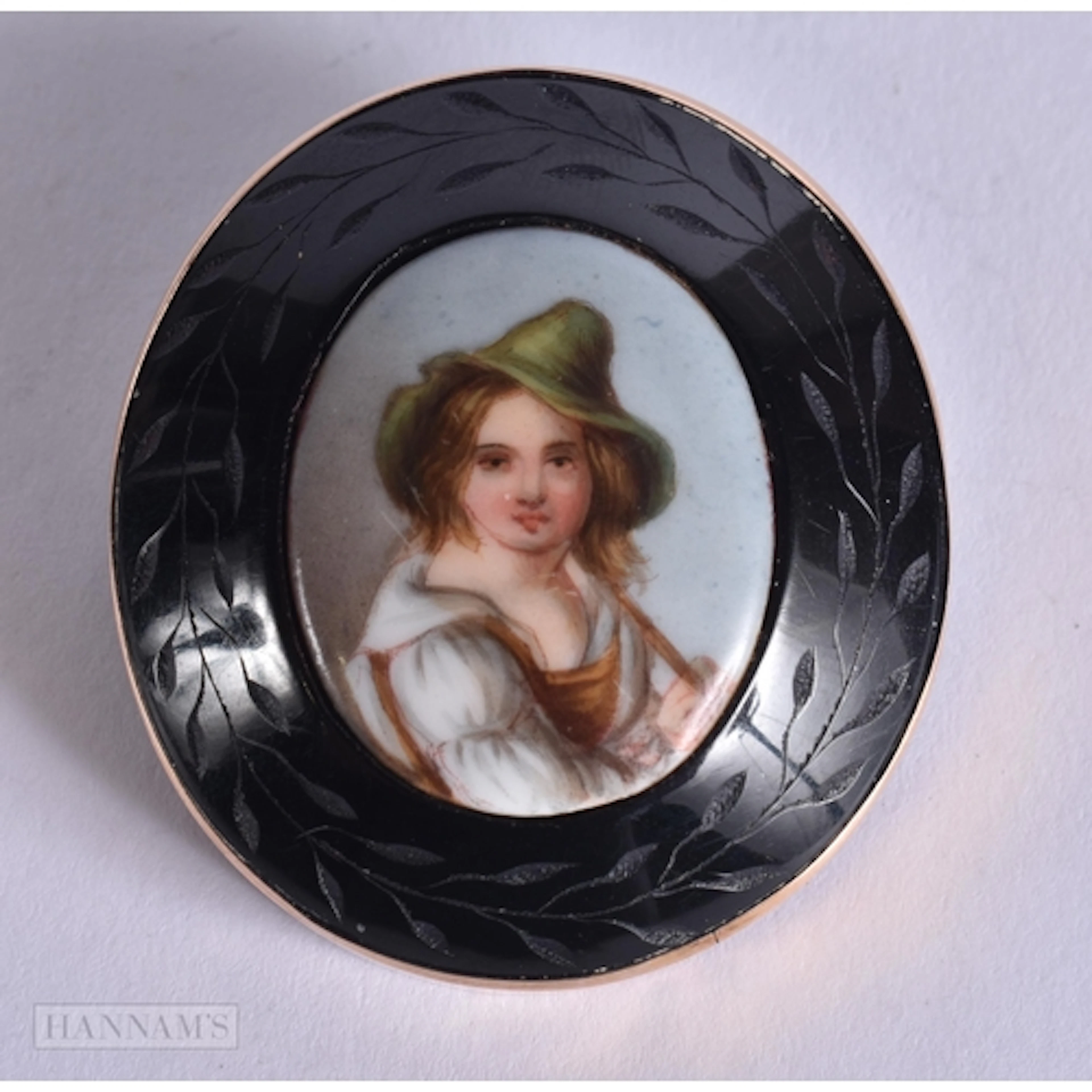 AN ANTIQUE PORCELAIN INSET BROOCH. 21.4 grams. 4.75 cm x 4.2...