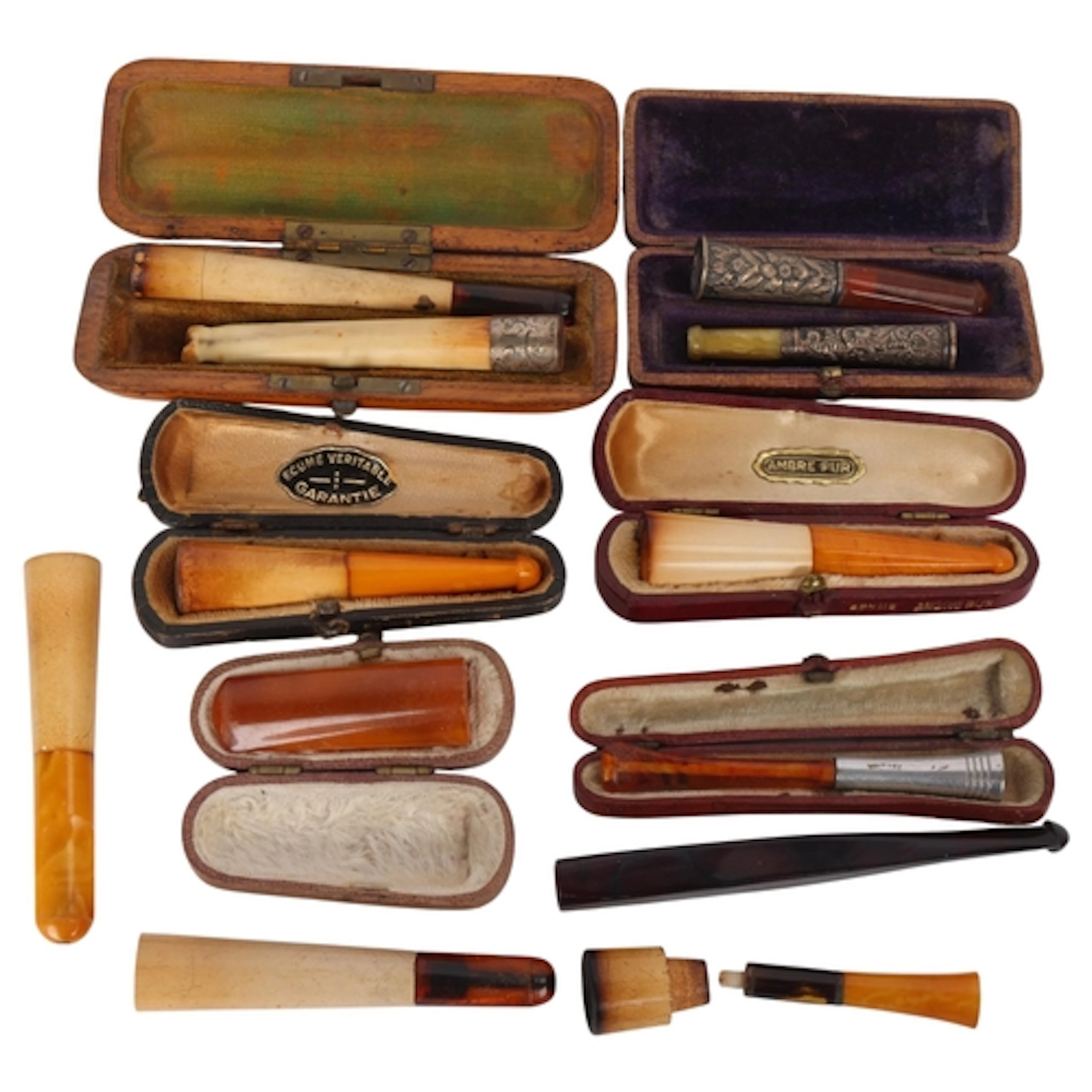 A small collection of Antique cheroot and cigarette holders,...