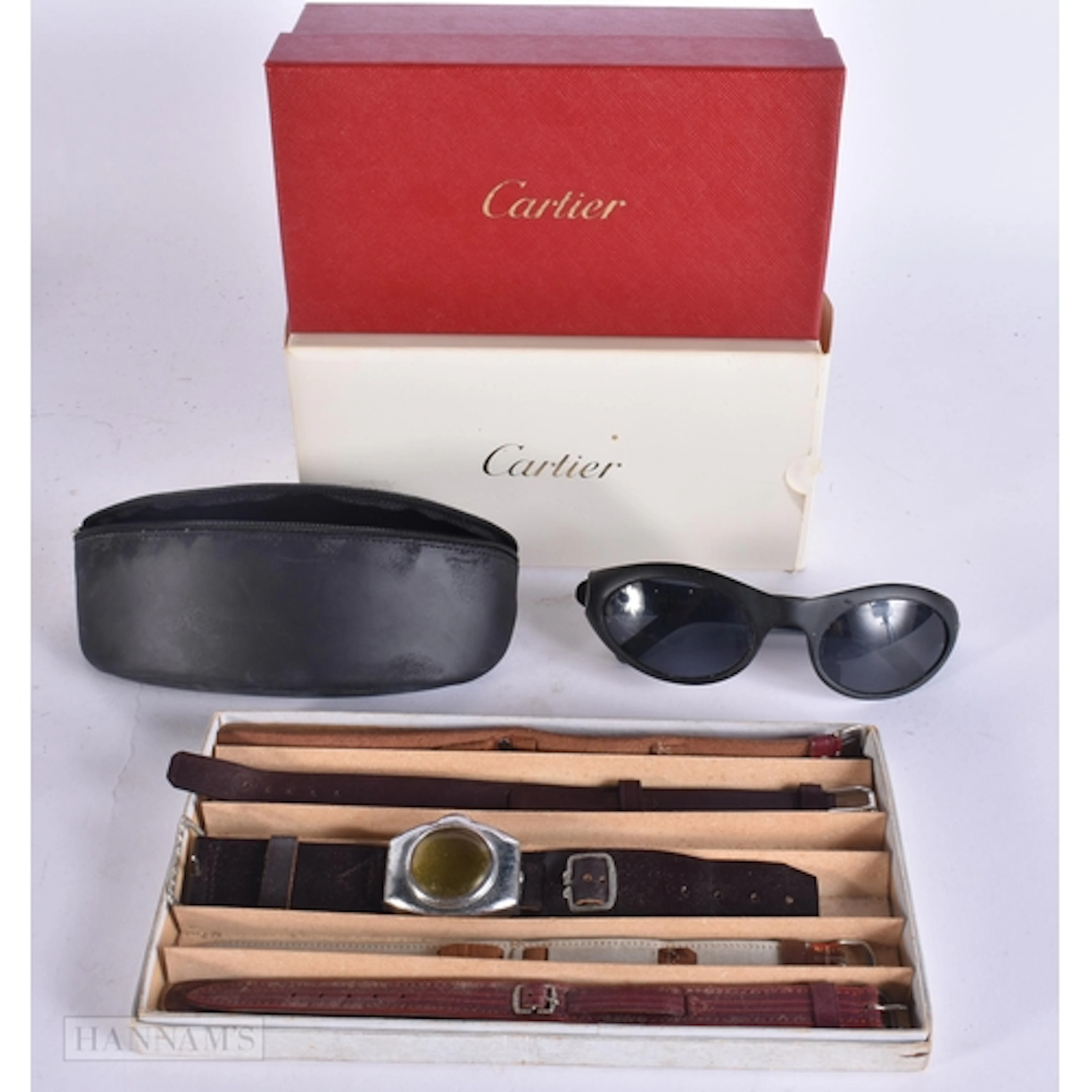 A BOXED PAIR OF CARTIER SUNGLASSES together with watch strap...