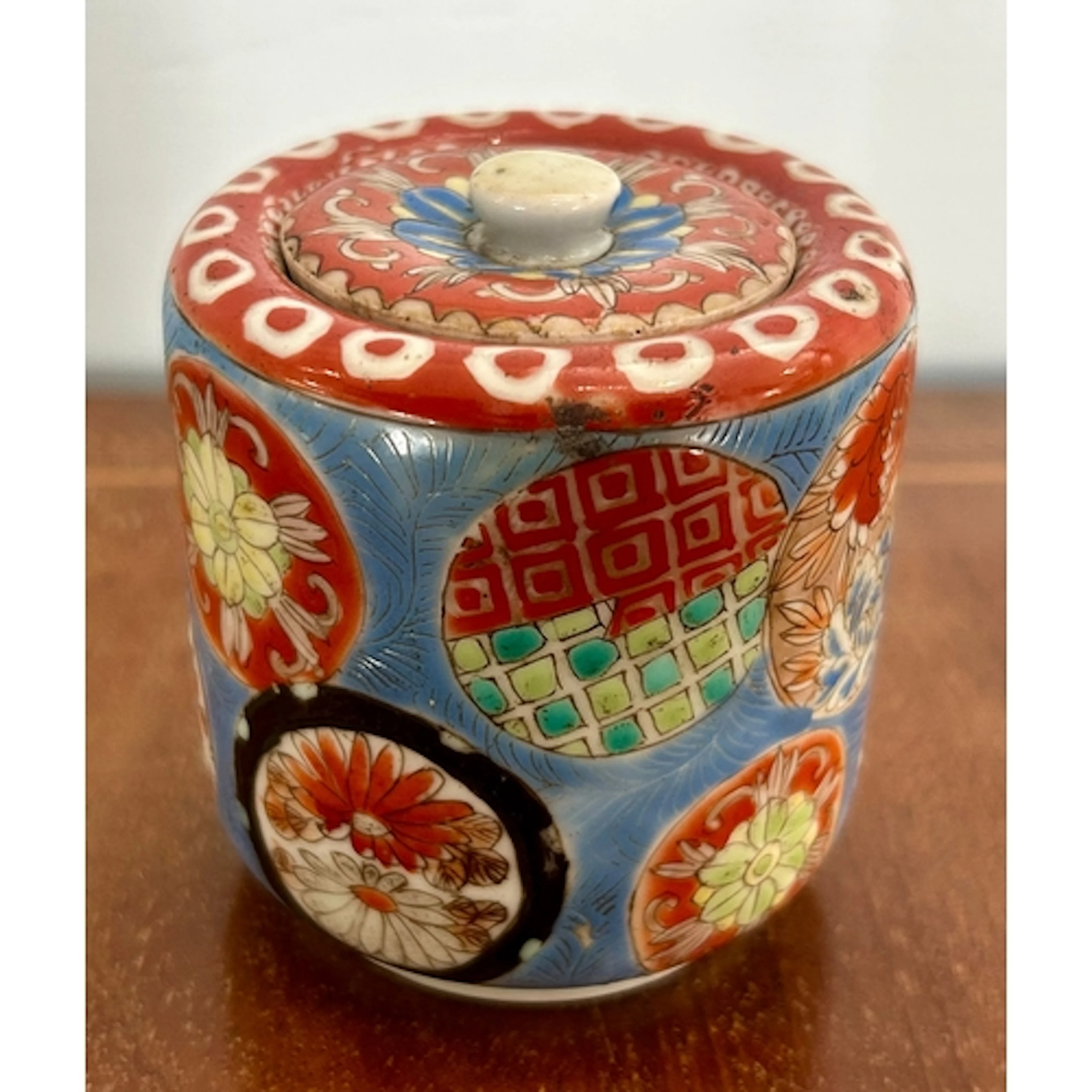 A Japanese Meiji period tobacco jar and cover, hand painted ...