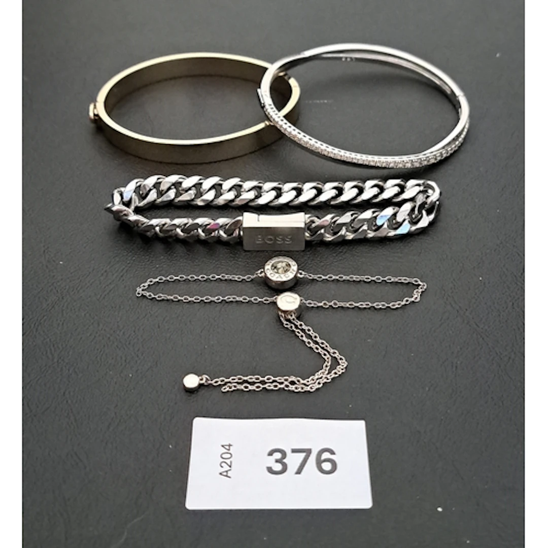 FOUR FASHION JEWELLERY BRACELETS comprising a Swarovski Hype...