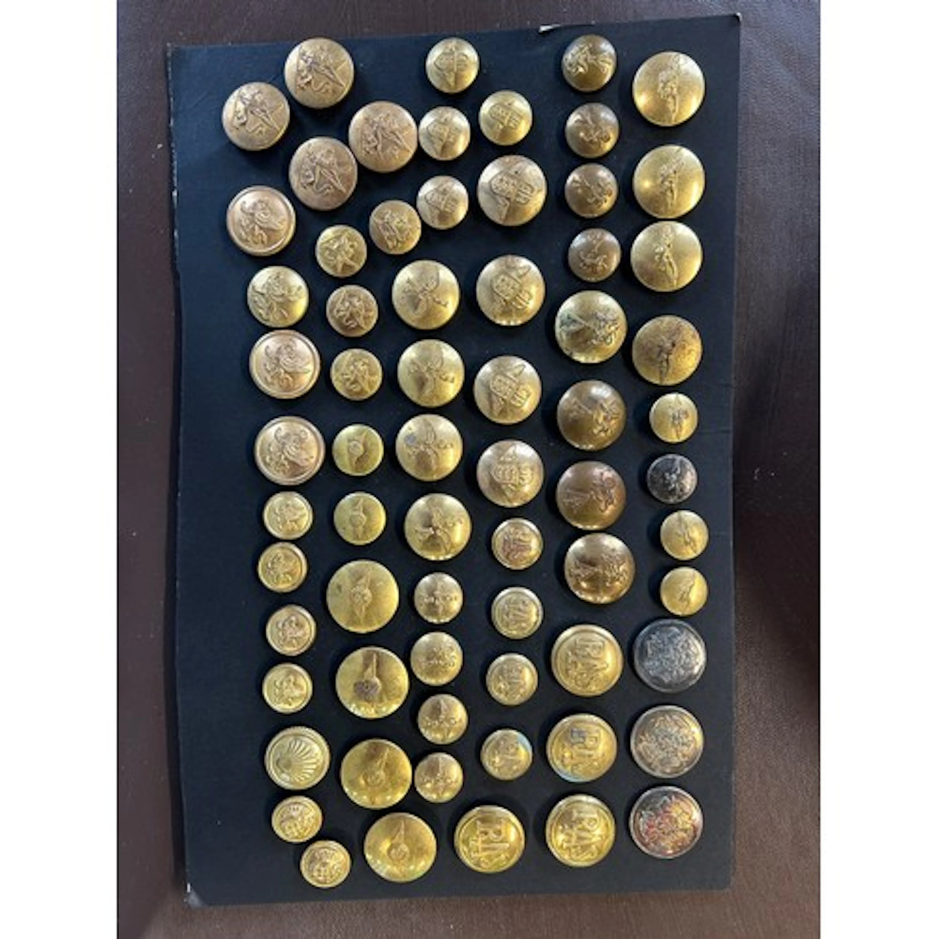 A carded display of scarce civilian uniform buttons c1930-19...