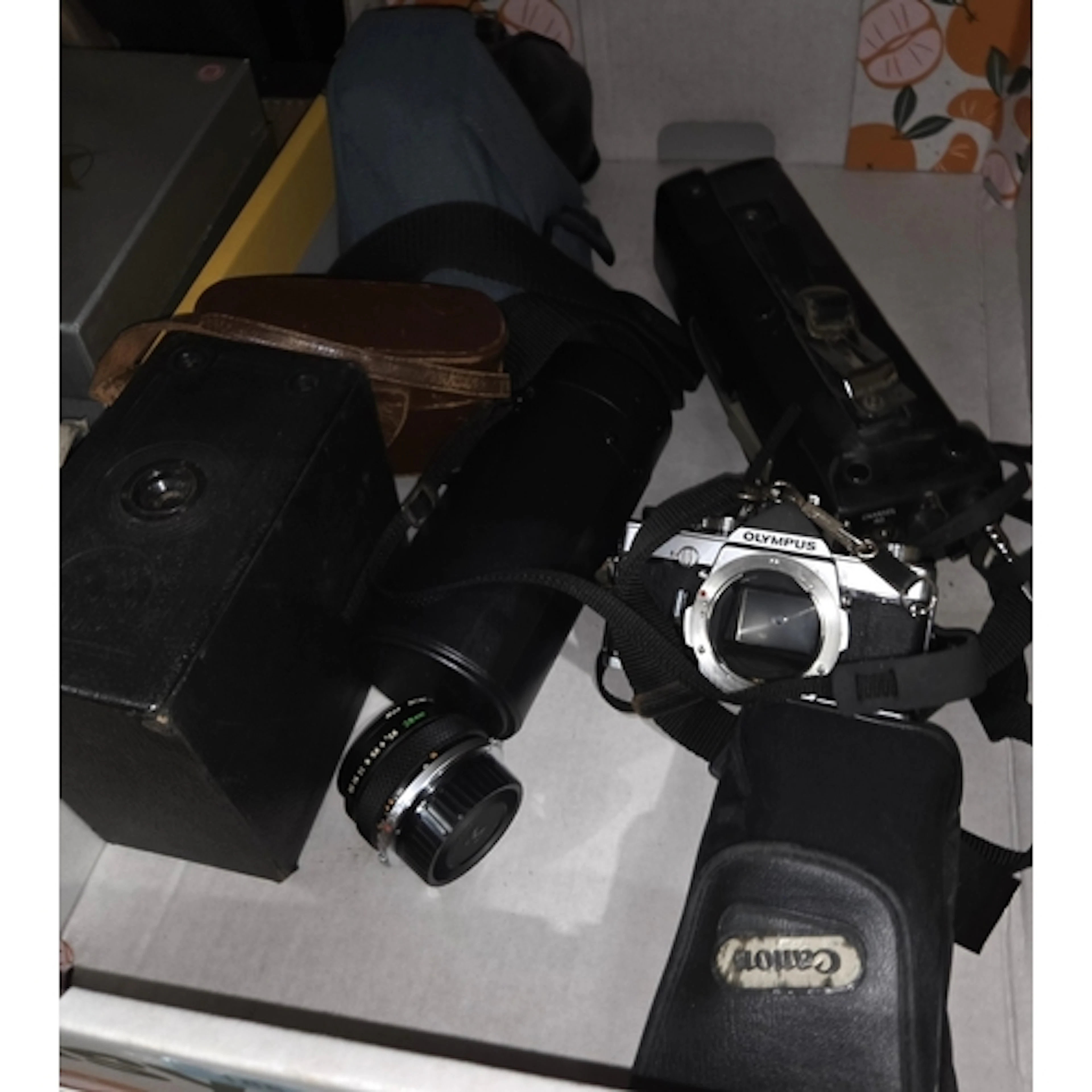 A collection of vintage cameras and lenses and a banjolele; ...