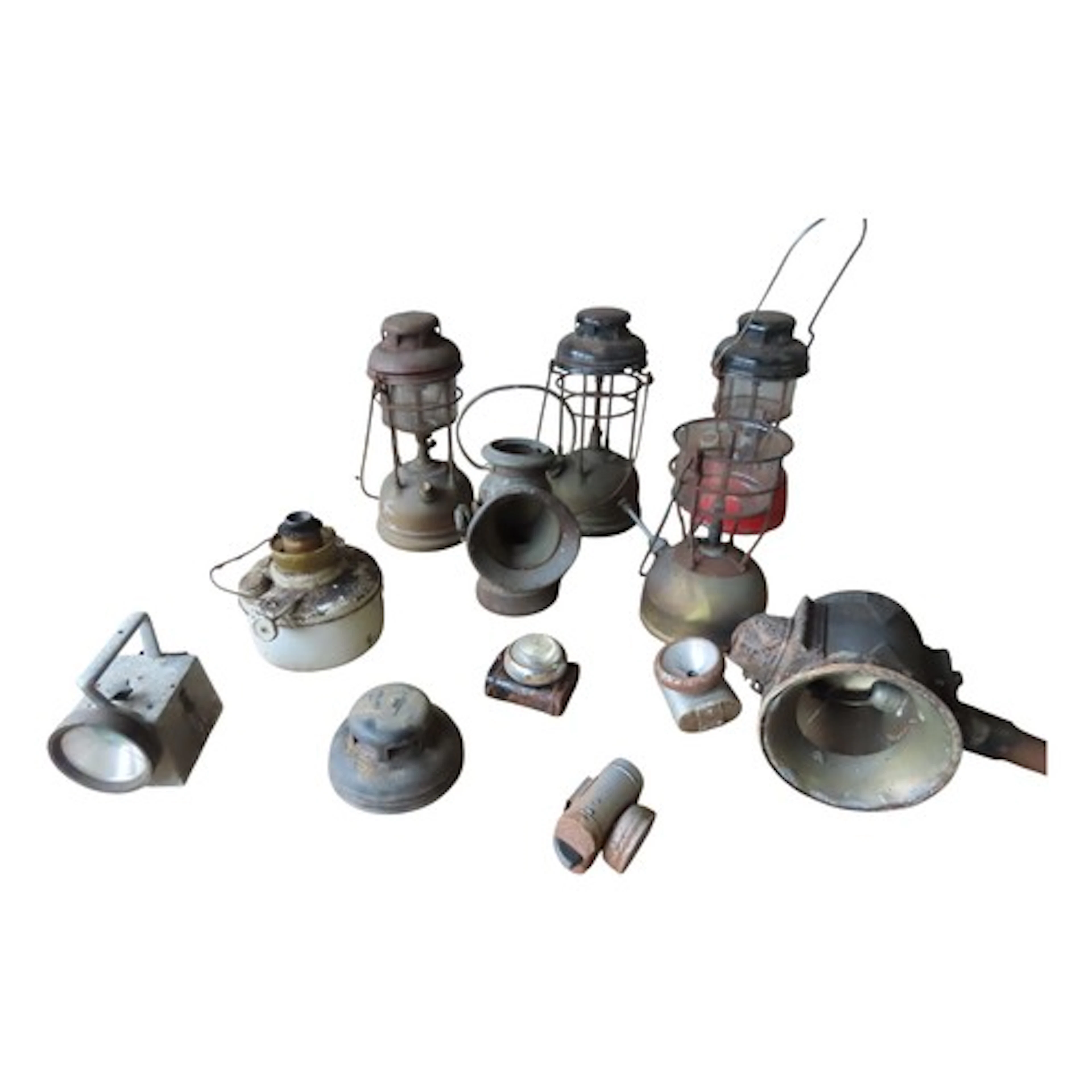 A box containing various vintage Tilley and other lamps