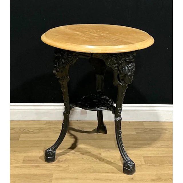 A Victorian style cast iron and hardwood pub table, 70cm hig...
