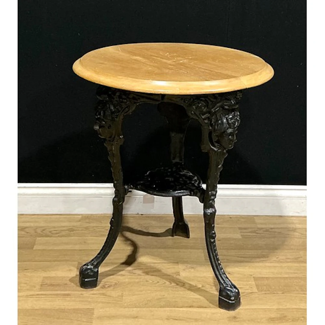 A Victorian style cast iron and hardwood pub table, 70cm hig...
