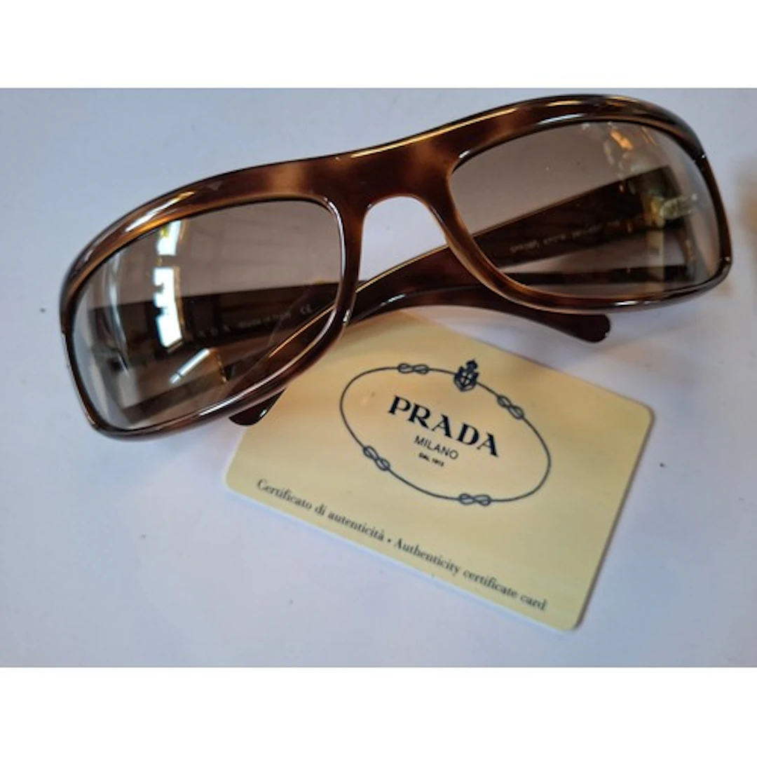 Prada- A pair of brown mock tortoiseshell wrap-around sungla...