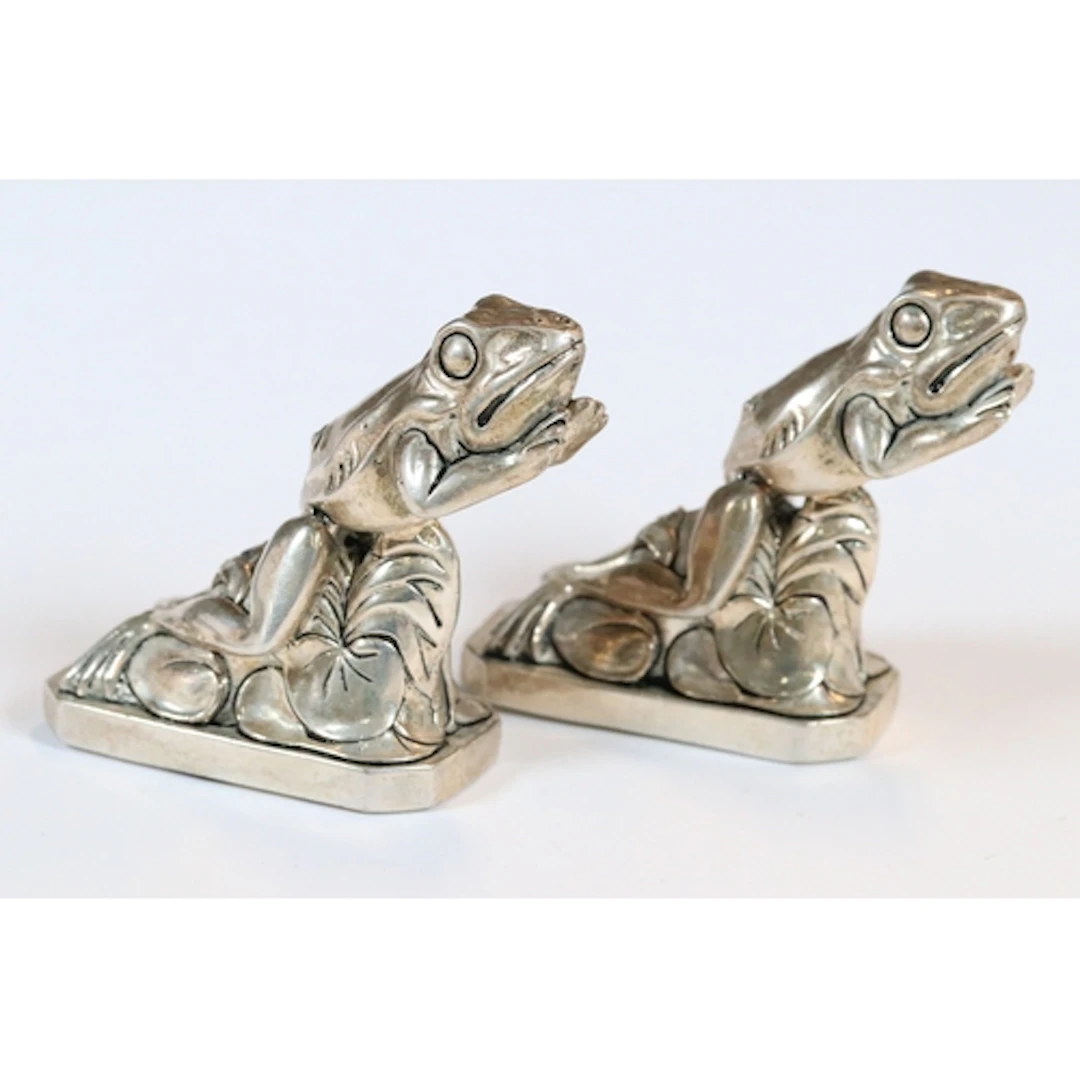 Pair of silver plated leaping frog condiments, 7cm high