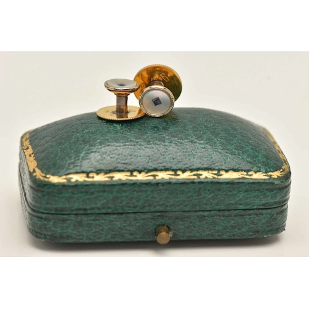 A CASED PAIR OF DRESS STUDS, yellow and white metal dress st...