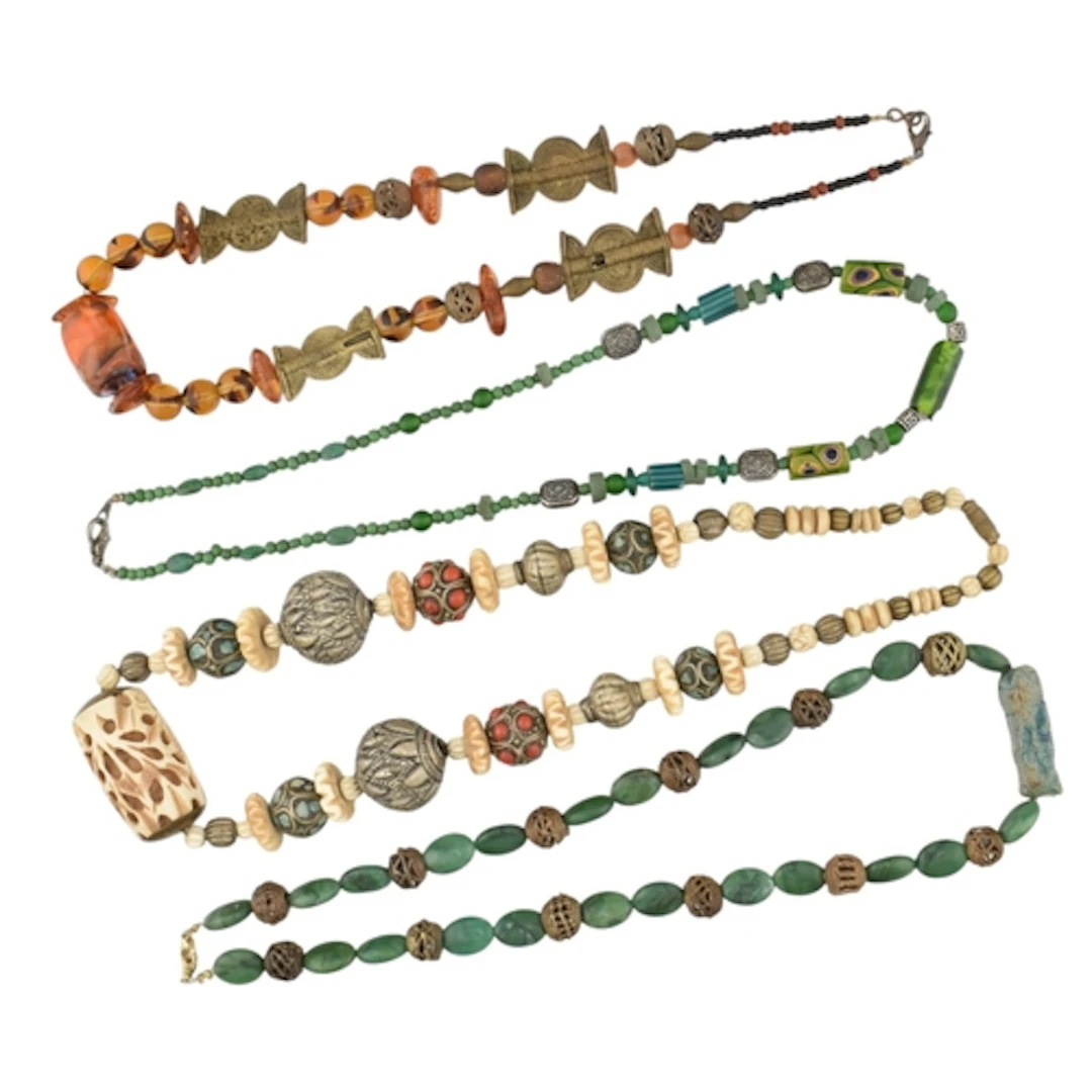 A collection of costume and ethnic jewellery necklaces. The ...