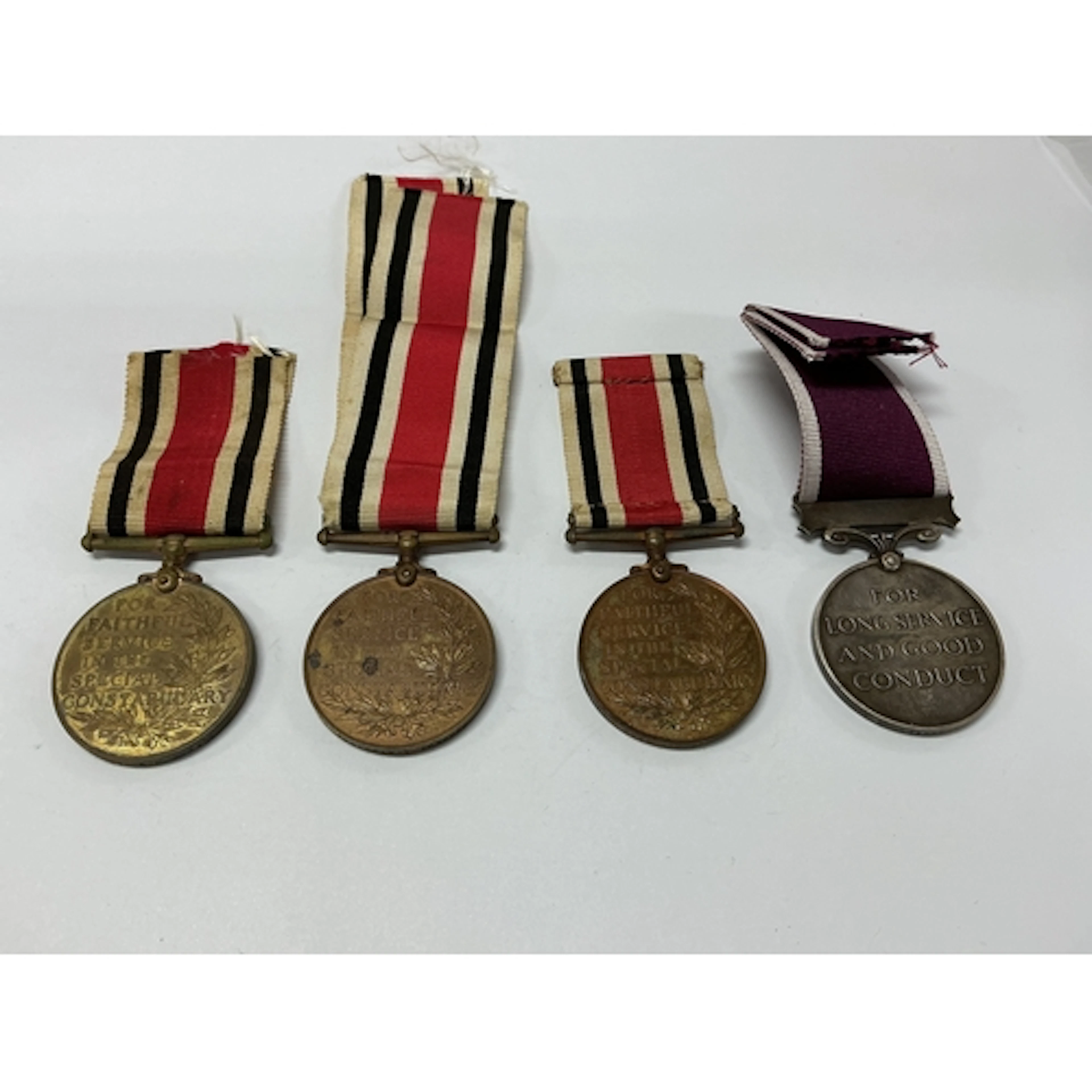 Group of four WW1 medals. RUPERT. M. M. POLLOCK, for faithfu...