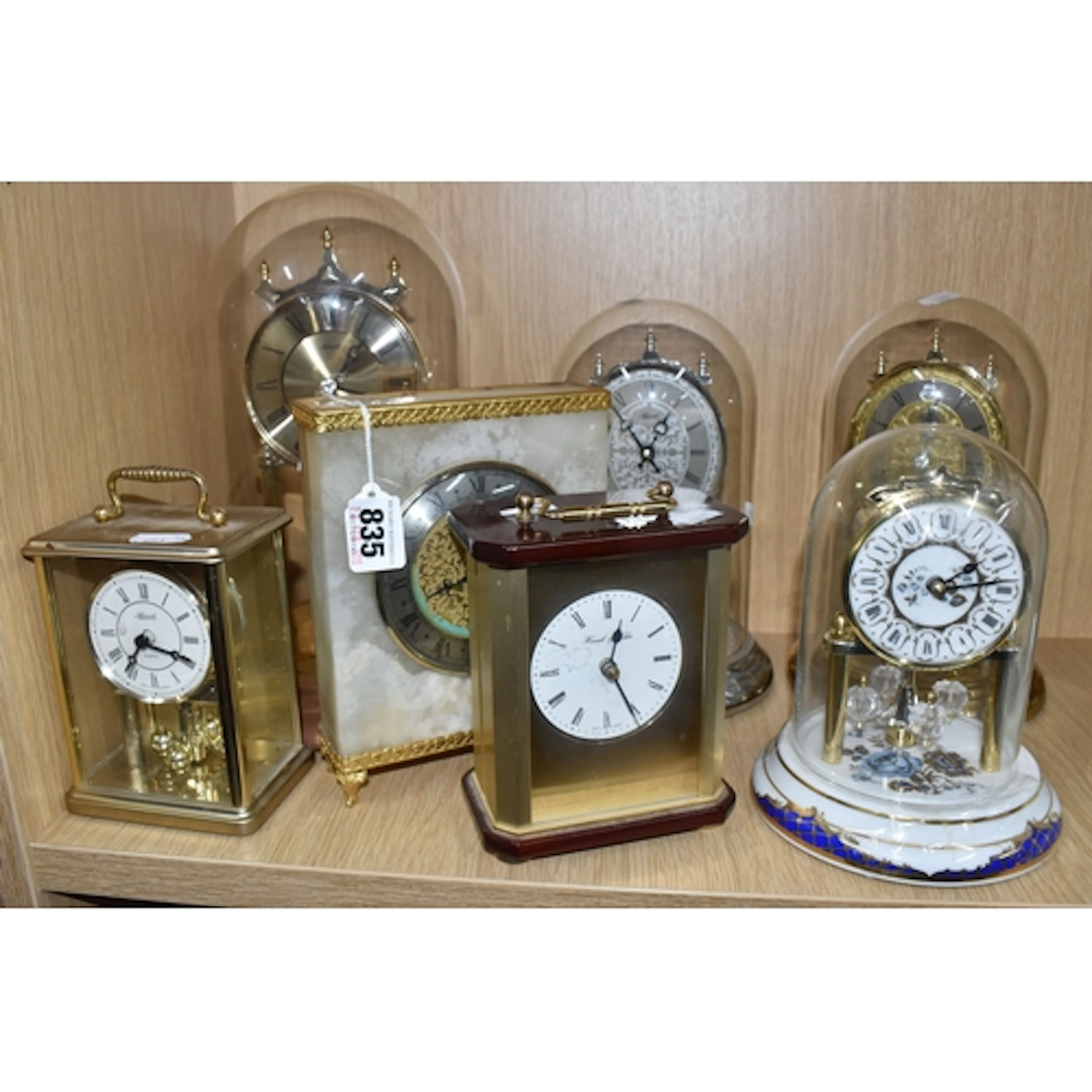 A GROUP OF SEVEN VINTAGE MANTEL CLOCKS, comprising a Luxuria...