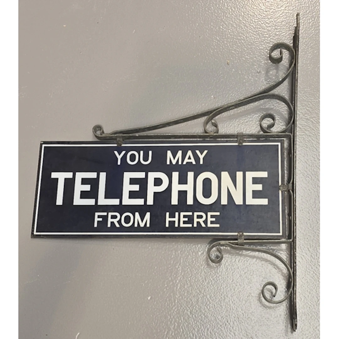 Double sided enamel sign "You May Telephone From Here" on wa...