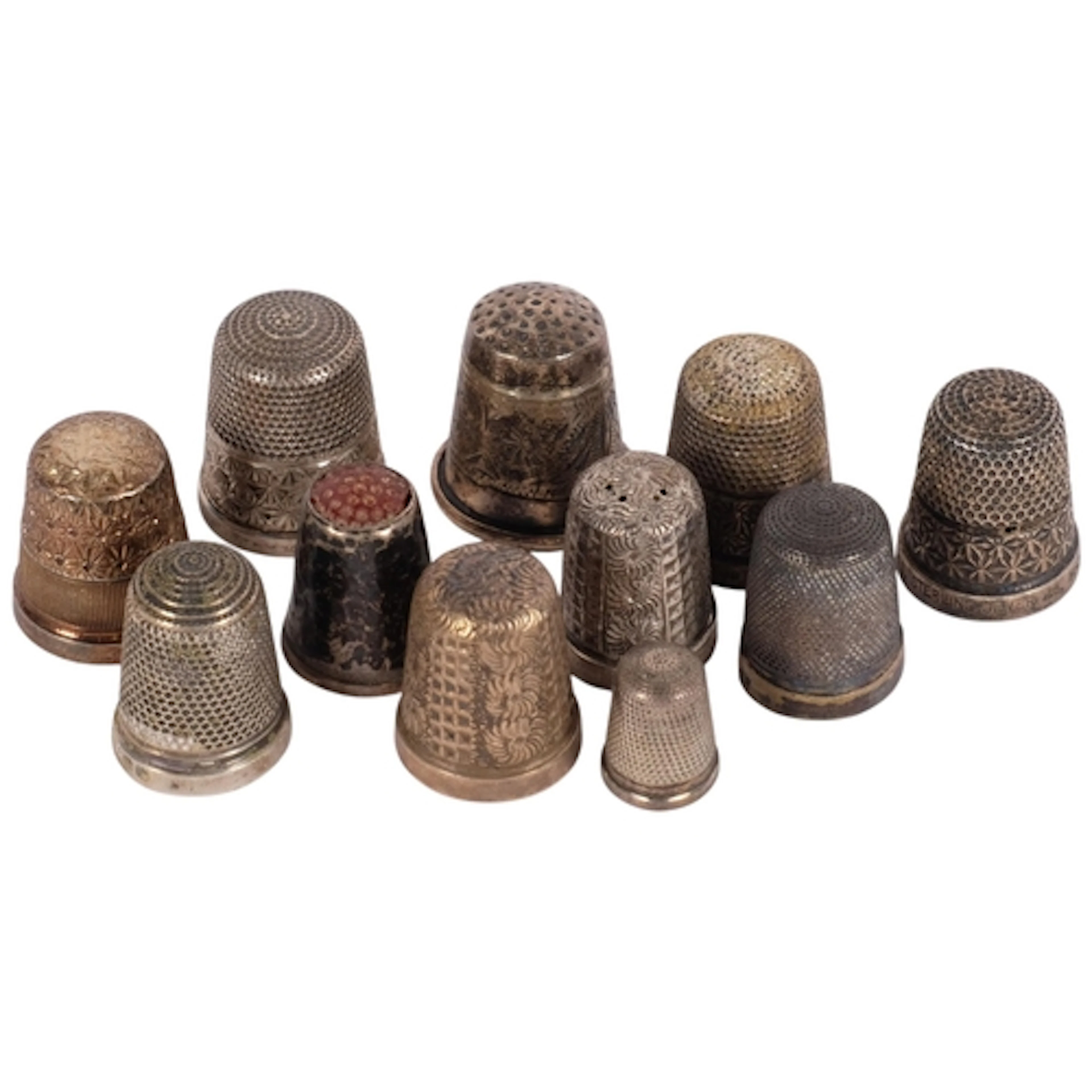 A collection of various silver thimbles, including a miniatu...