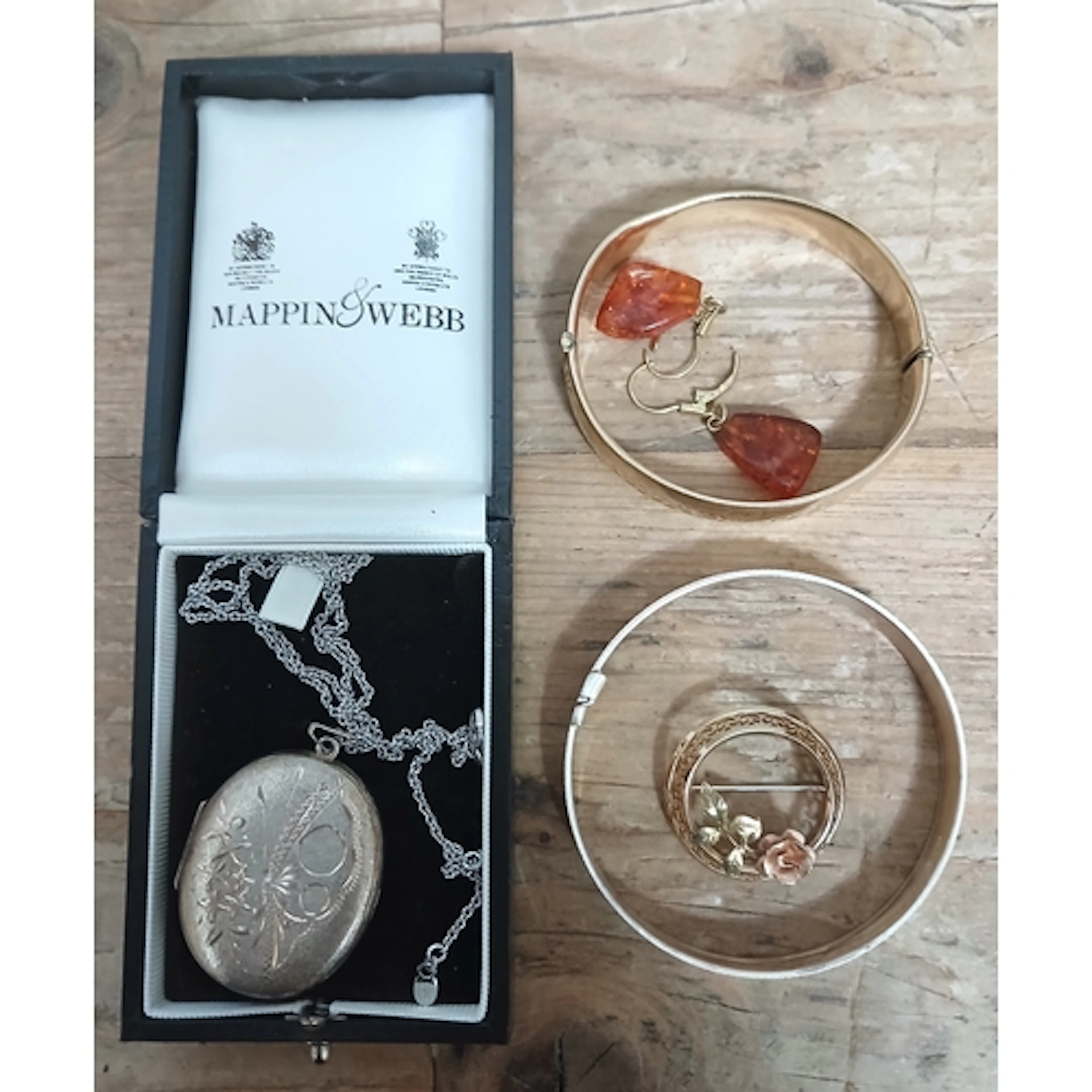 A mixed lot comprising a hallmarked silver locket, a hallmar...