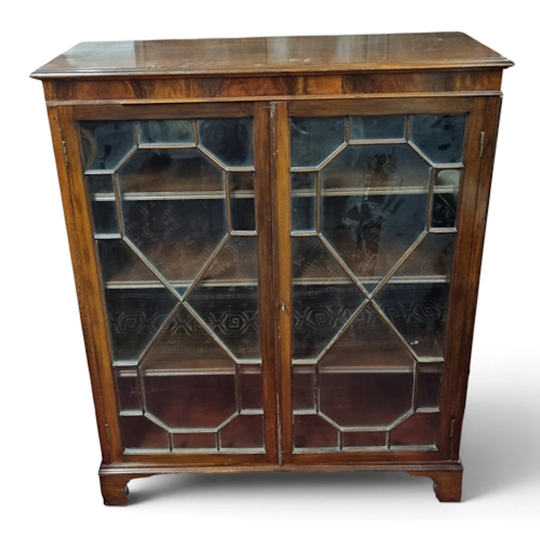 An Edwardian Mahogany two door Bookcase with astragal glazed...