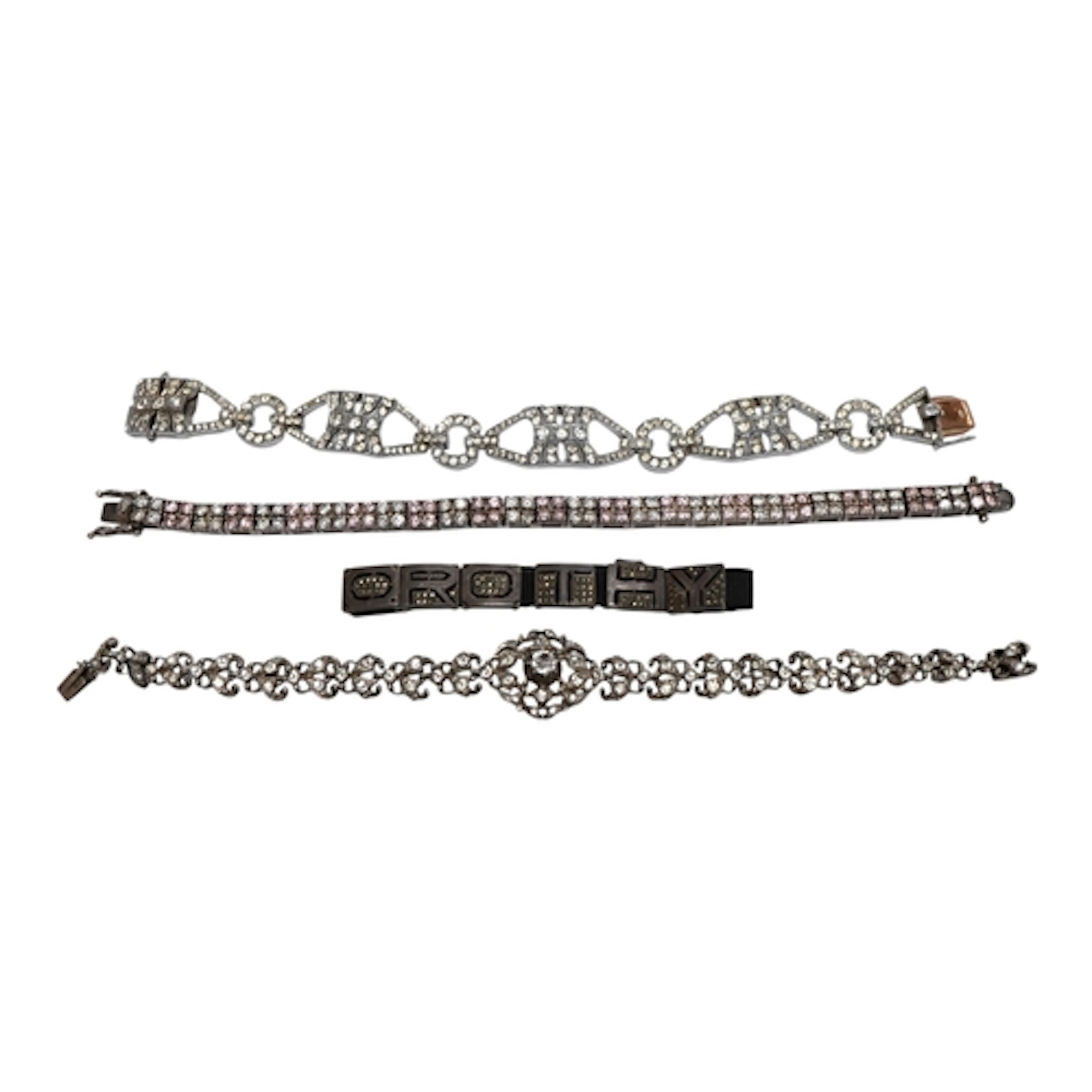 Four assorted white meal bracelets, to include silver and tw...