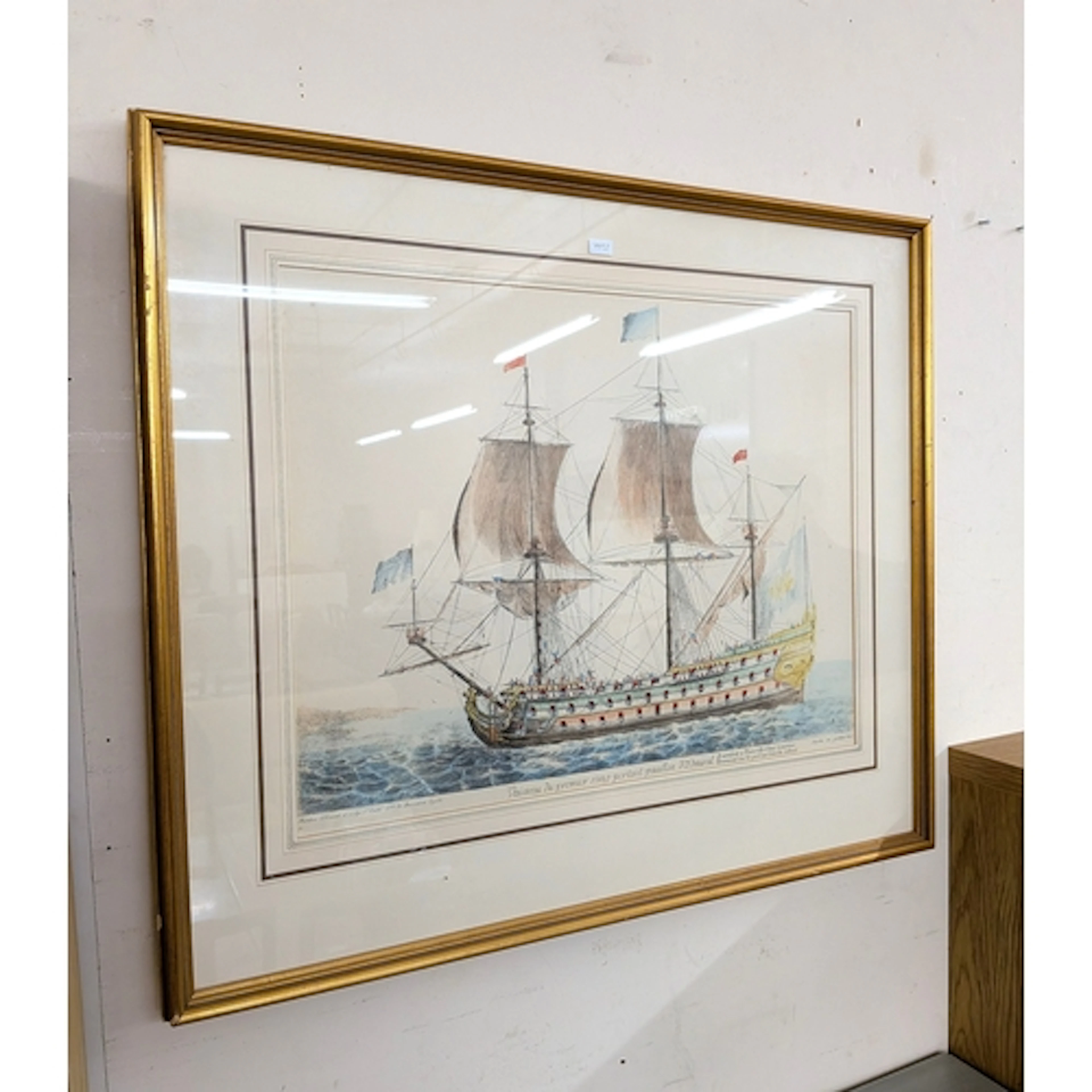 A coloured print of an antique French sailing war ship