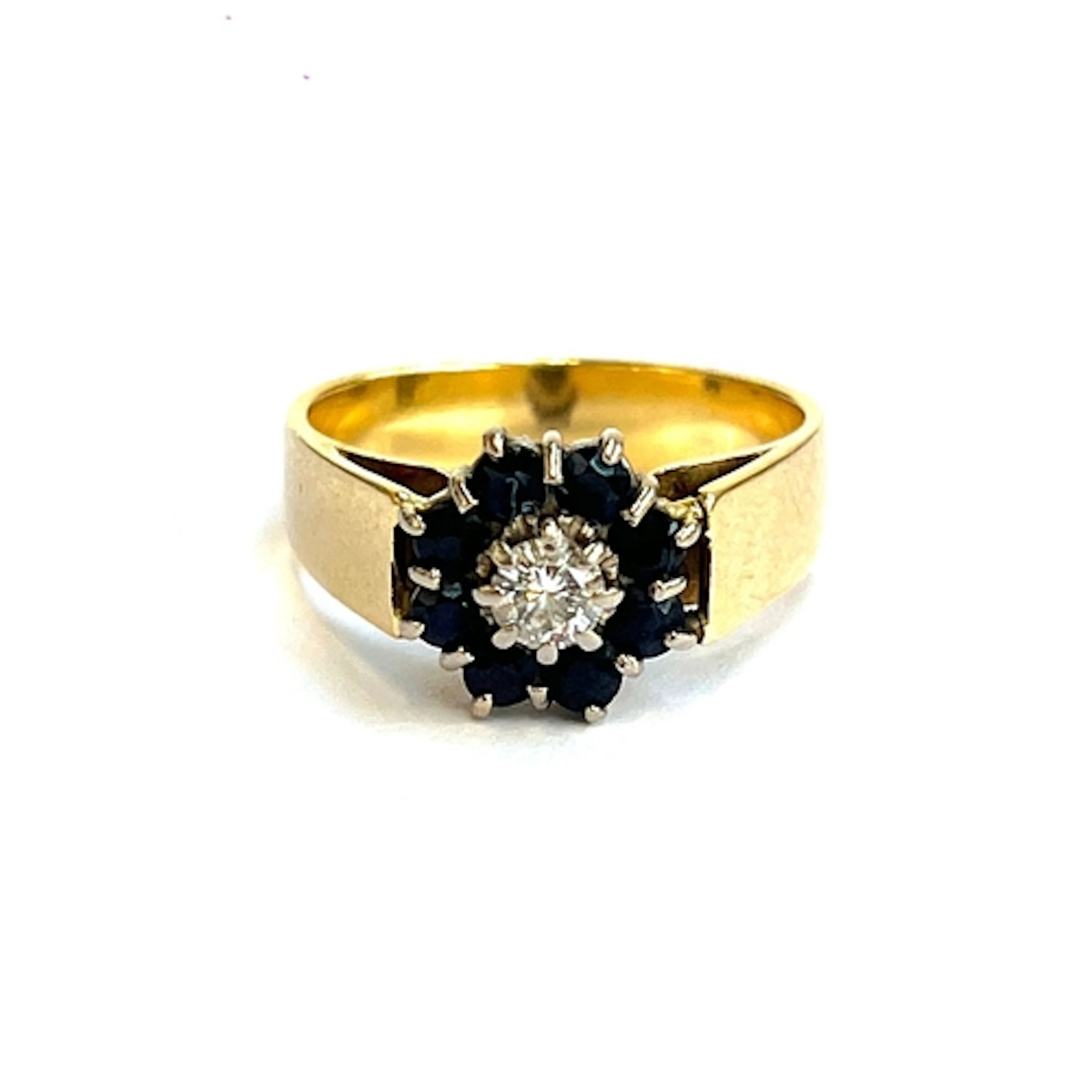 An 18ct gold, diamond and sapphire cluster ring, the central...