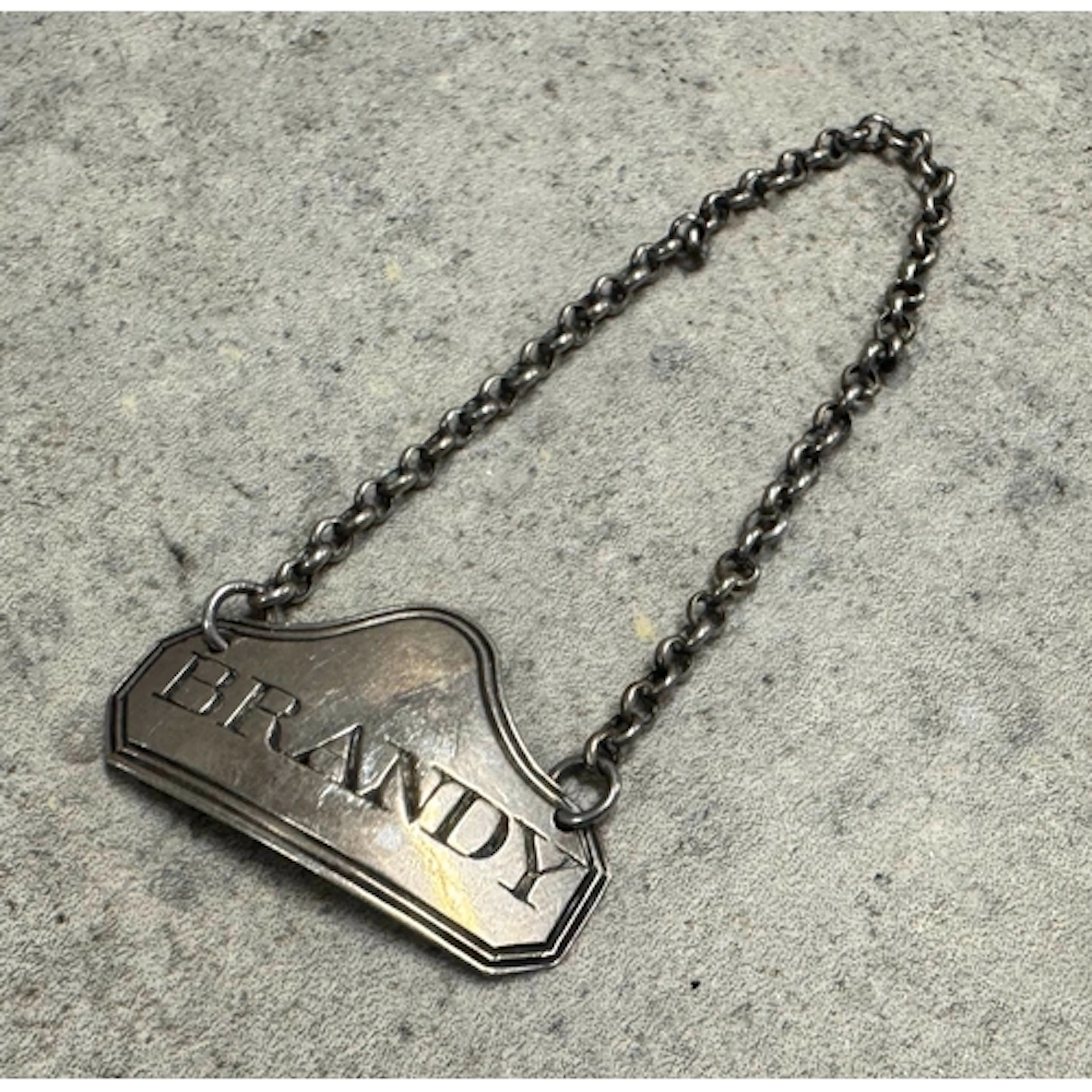 A silver decanter label for ‘Brandy’. London 1805. By Thomas...