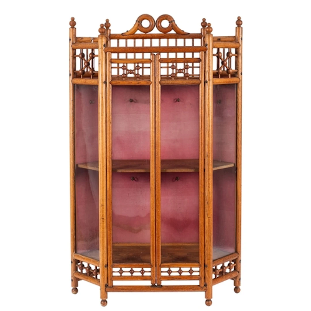An oak and glazed wall-hanging cabinet in Aesthetic style, i...