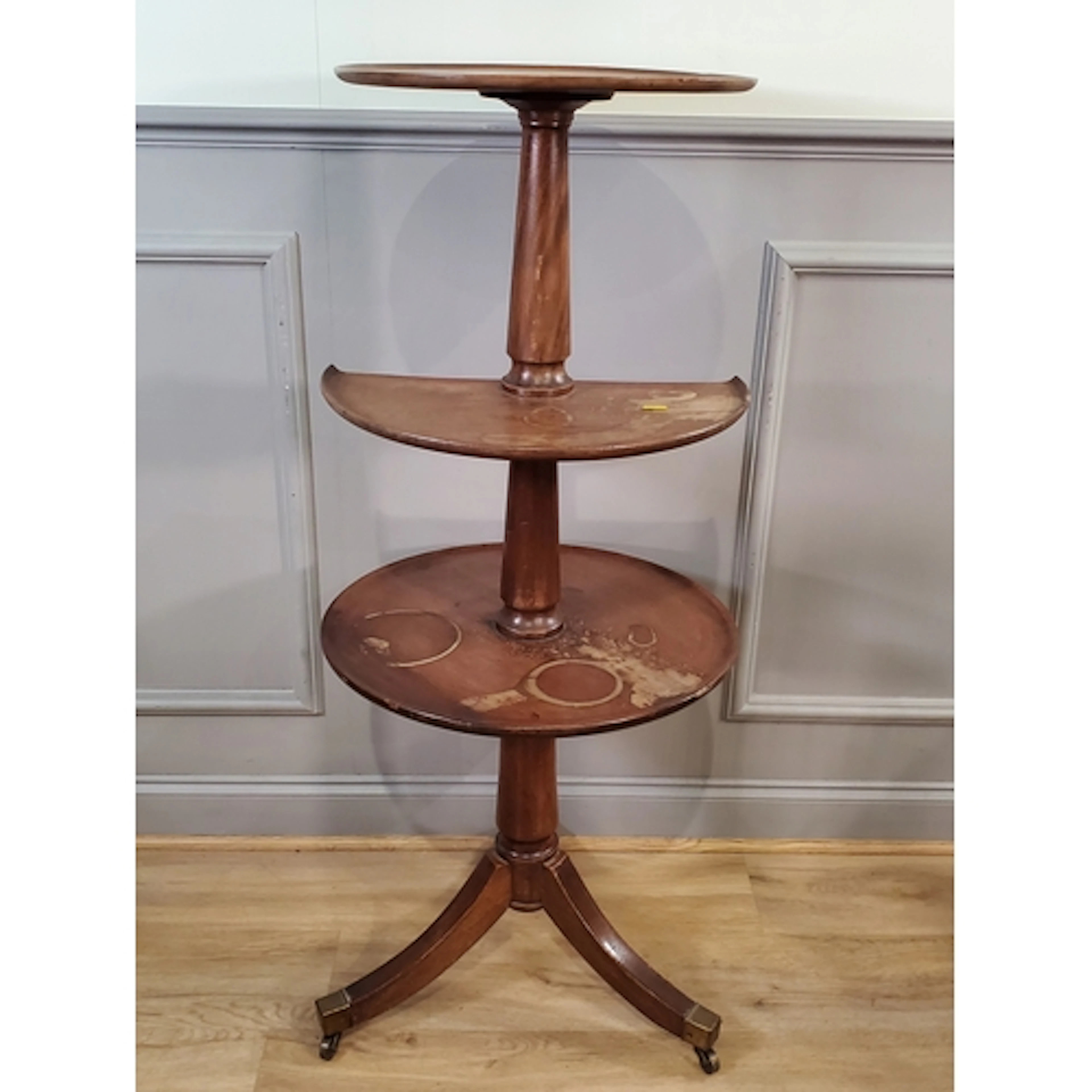 A 19th Century mahogany circular three-tier Dumb Waiter on t...