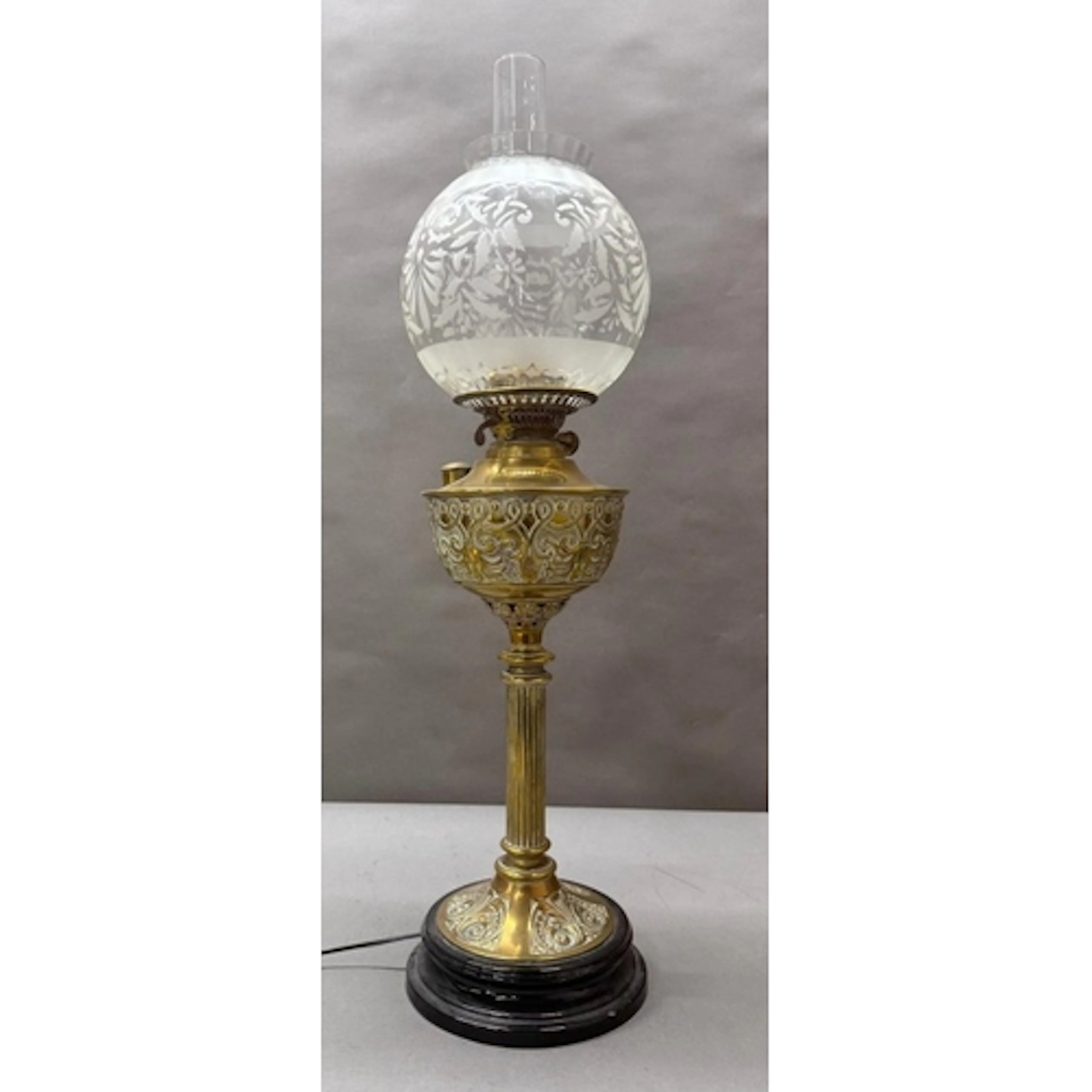 A brass Corinthian column converted oil lamp with etched gla...