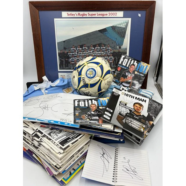 A collection of sporting memorabilia to include four signed ...