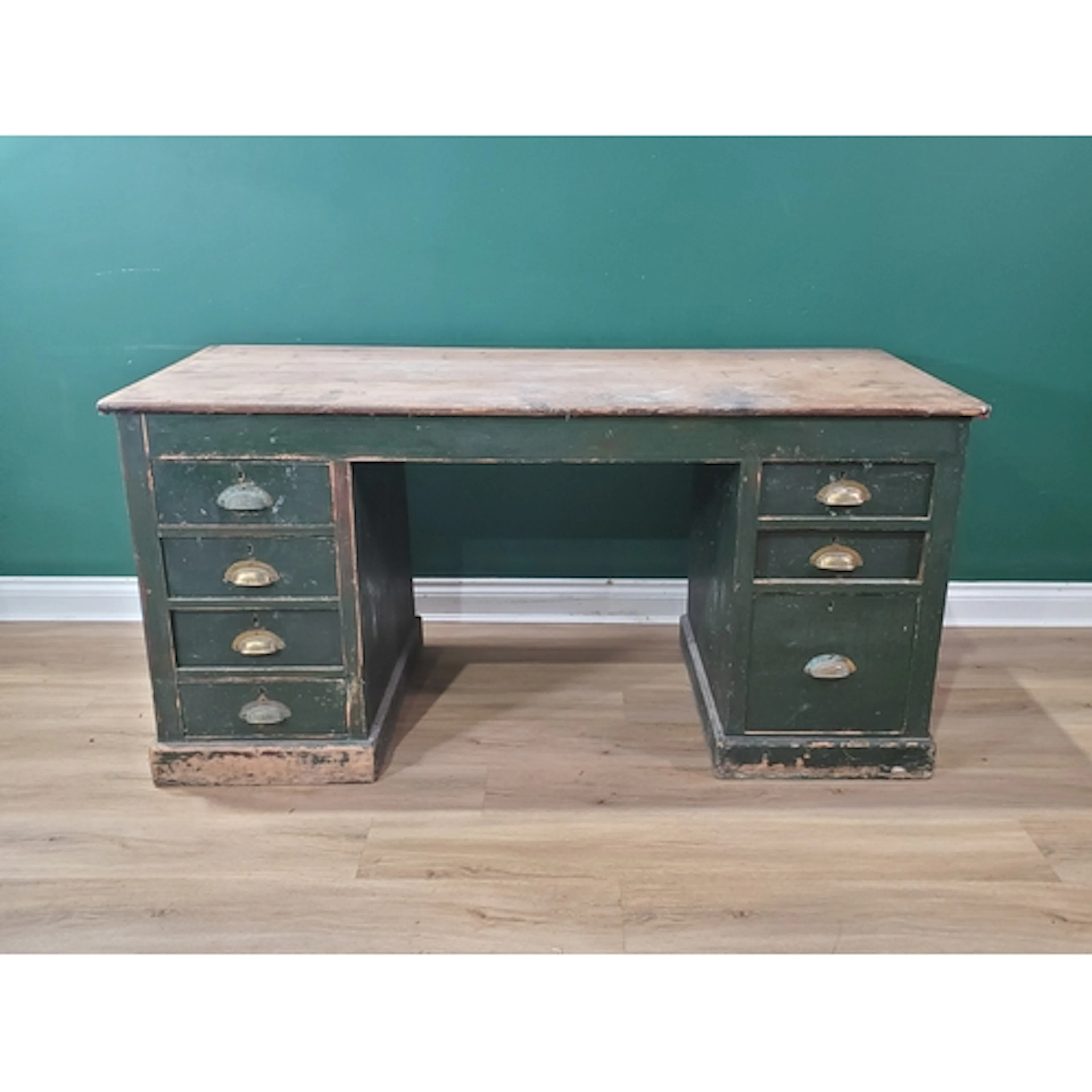 An antique painted pine Pedestal Desk fitted seven drawers o...