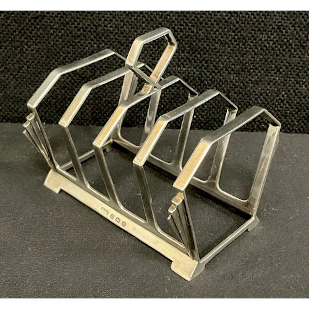 An Art Deco silver four division toast rack, Deakin & Franci...