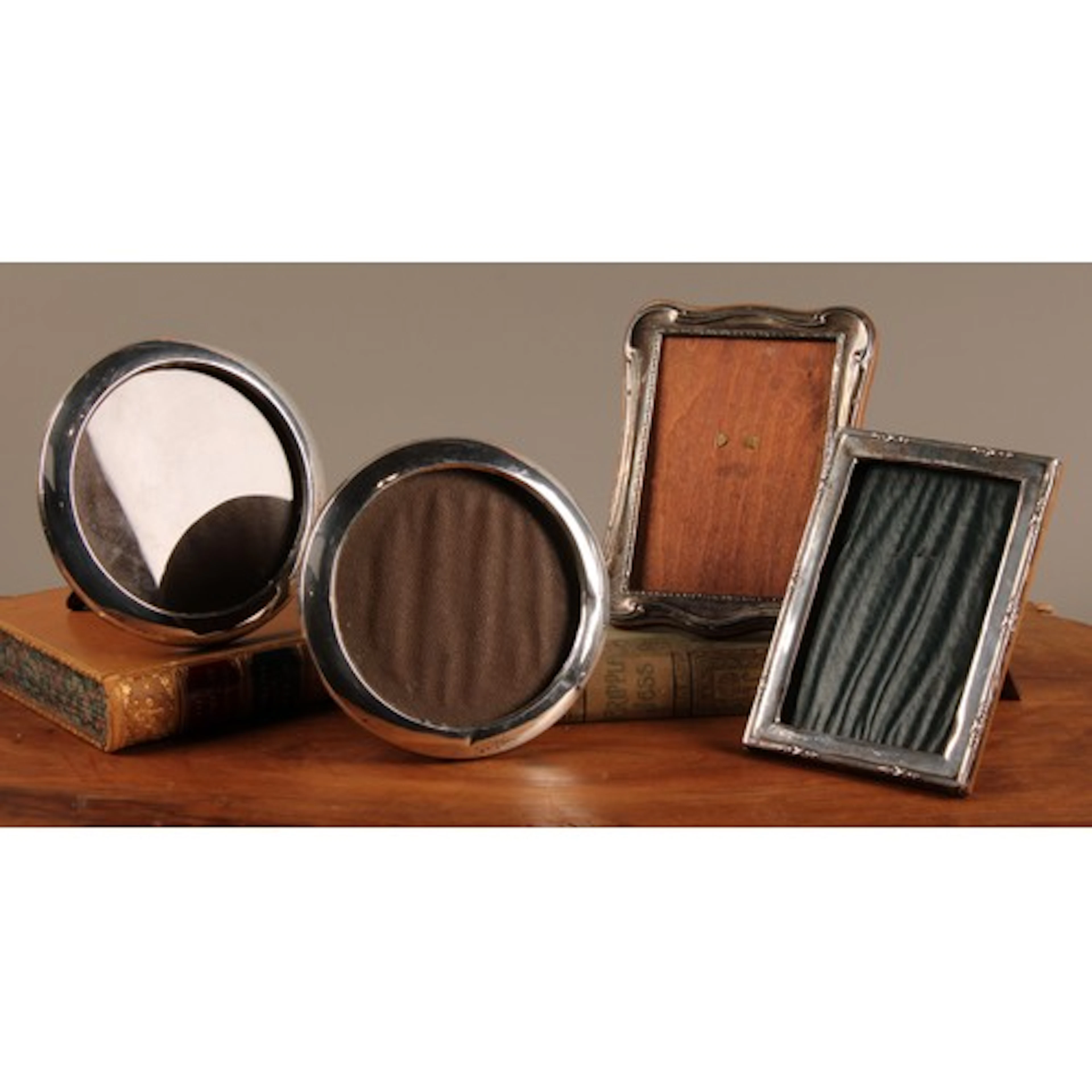 A pair of George V silver circular easel photograph frames, ...