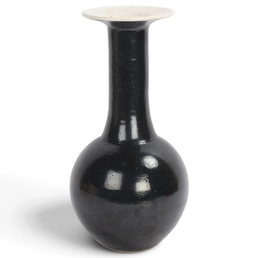 A studio pottery vase with black glaze, impressed makers mar...