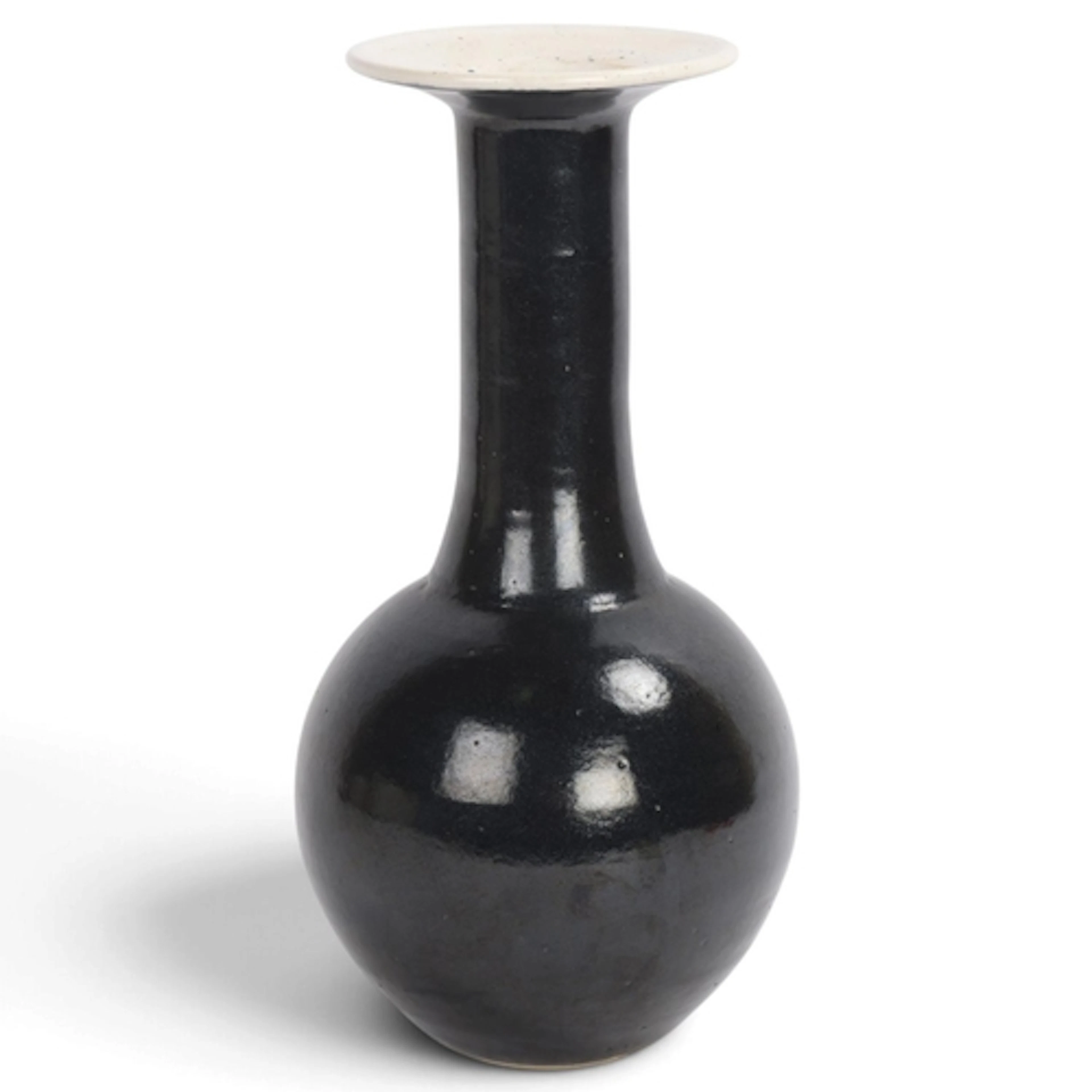 A studio pottery vase with black glaze, impressed makers mar...