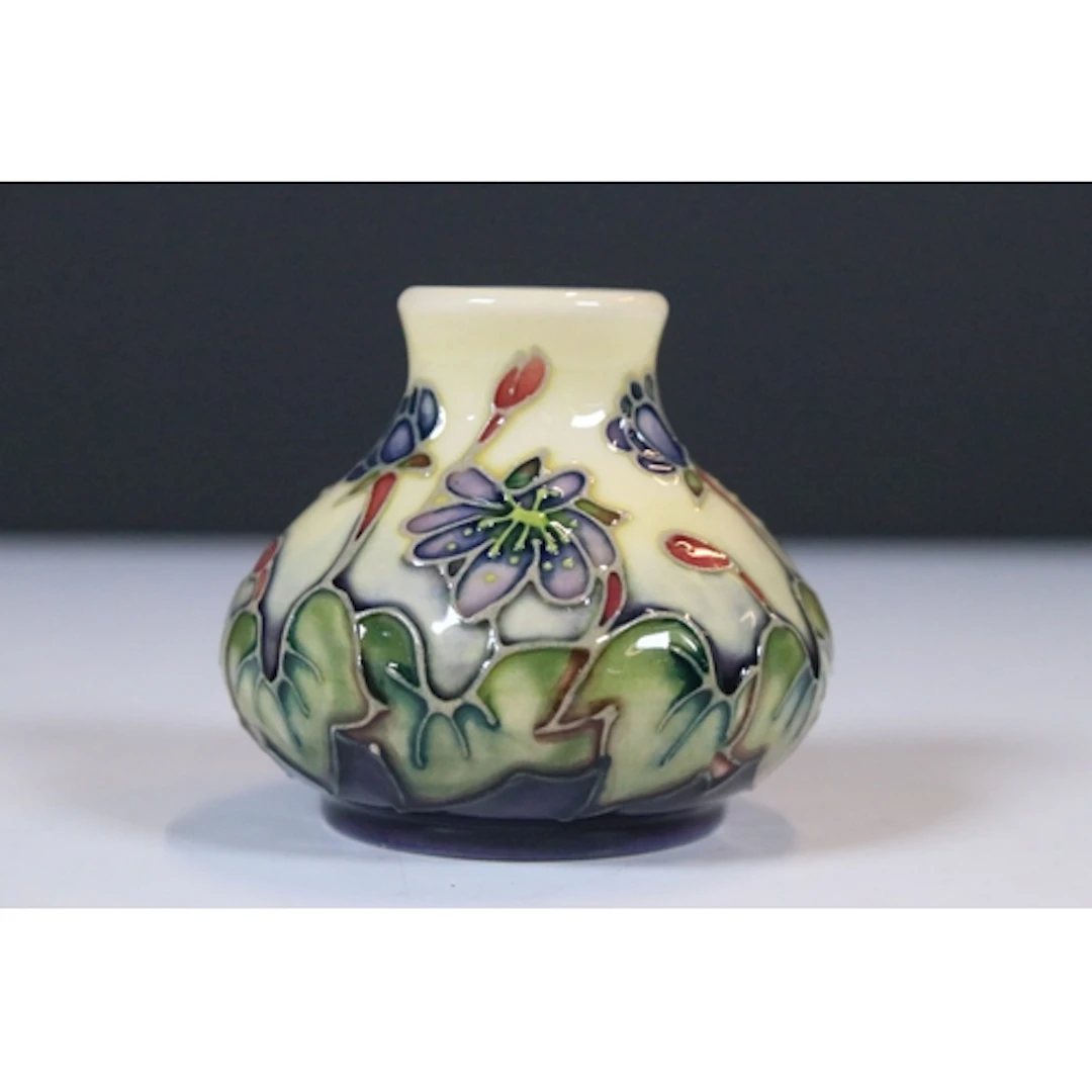 Moorcroft pottery 'Hepatica' pattern bud vase, designed by E...