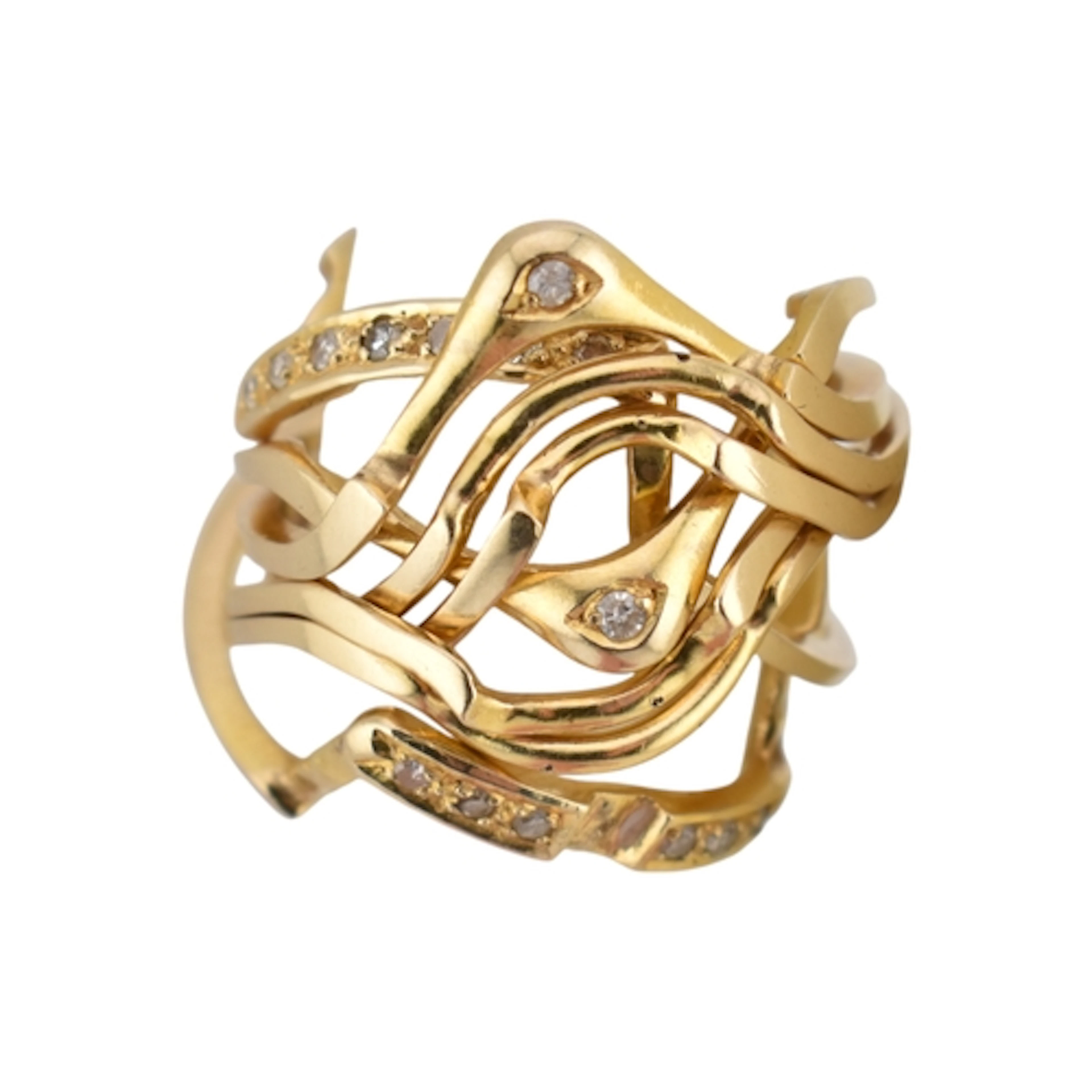 A 14ct gold and diamond puzzle ring. The ring being stamped ...