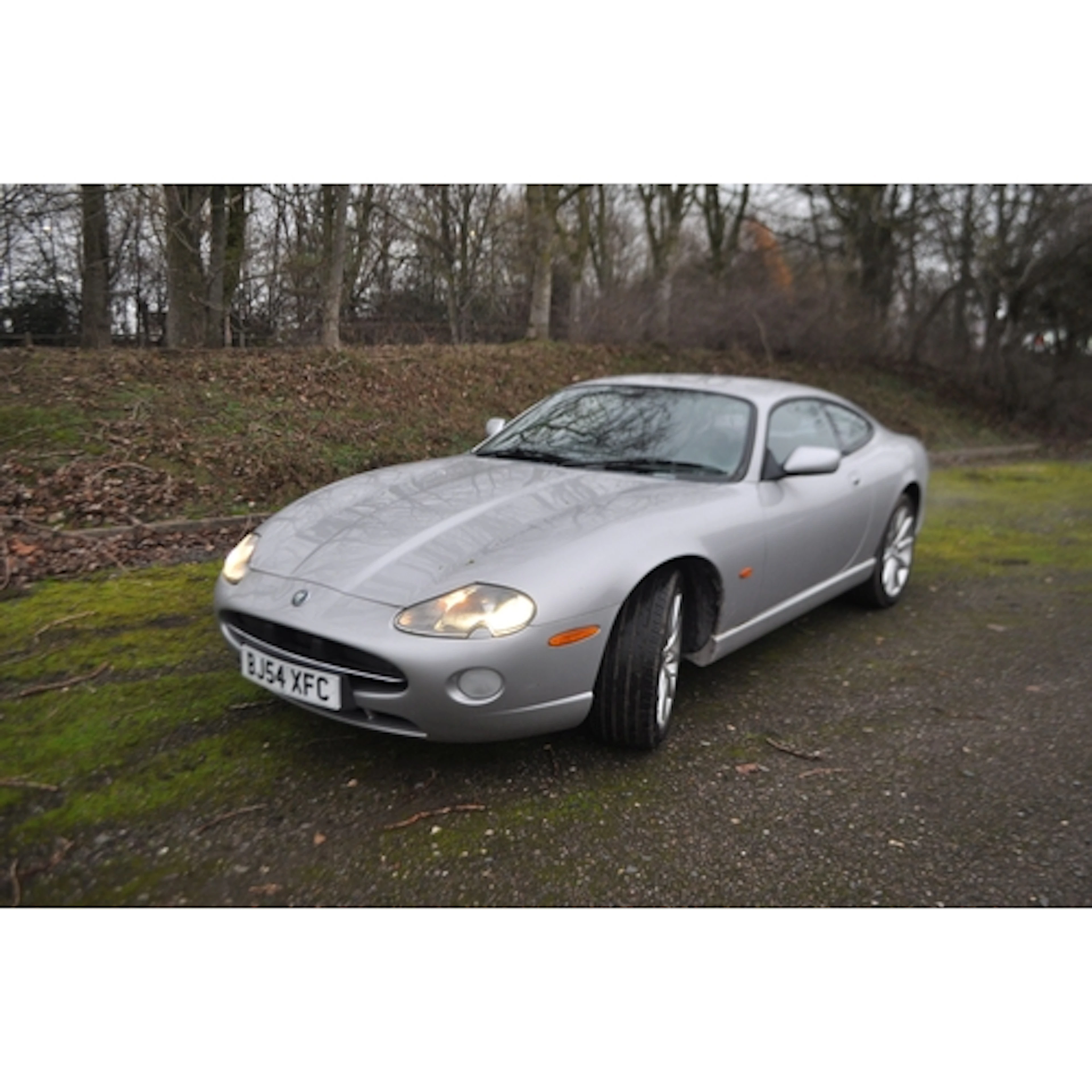 A 2004 JAGUAR XK8 TWO DOOR SPORTS COUPE AUTO, in silver with...