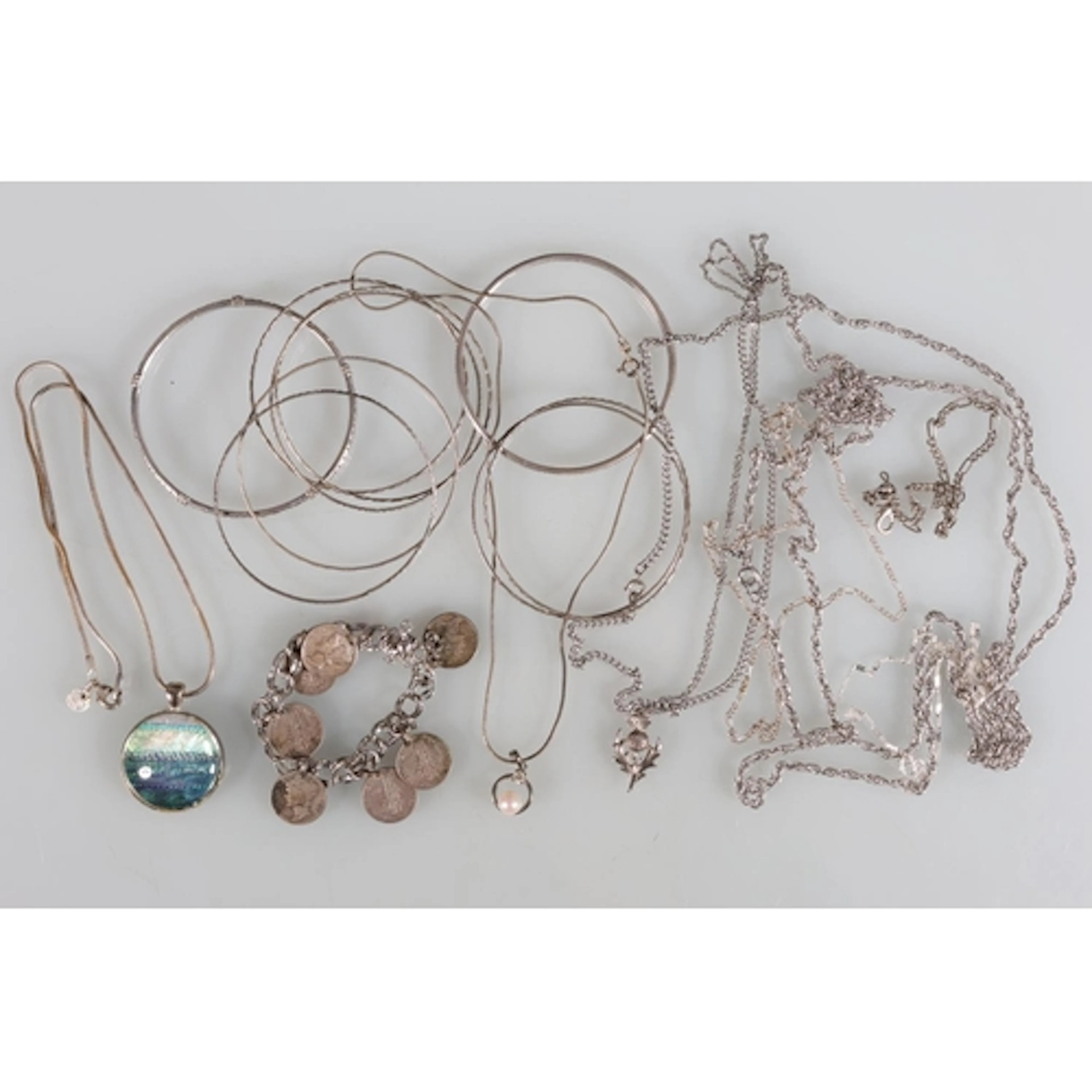 Two Sterling silver bangles 25g, silver and other chains, co...