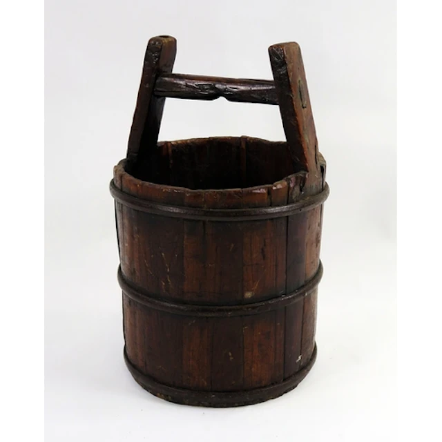 A hardwood well bucket, of coopered construction, 51cm high,...