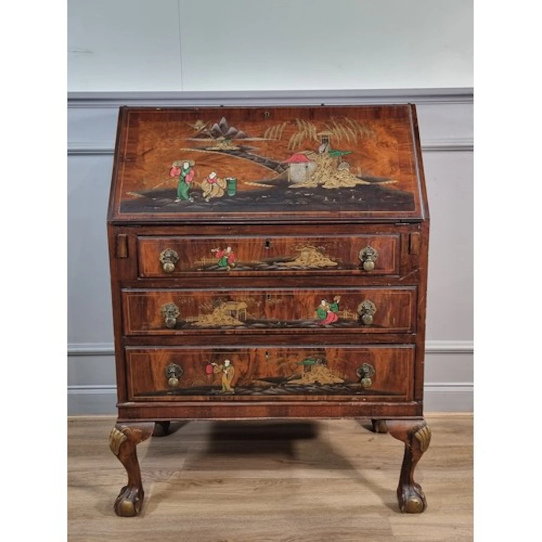 A 1920's walnut Bureau with Chinoiserie decorations, the fal...