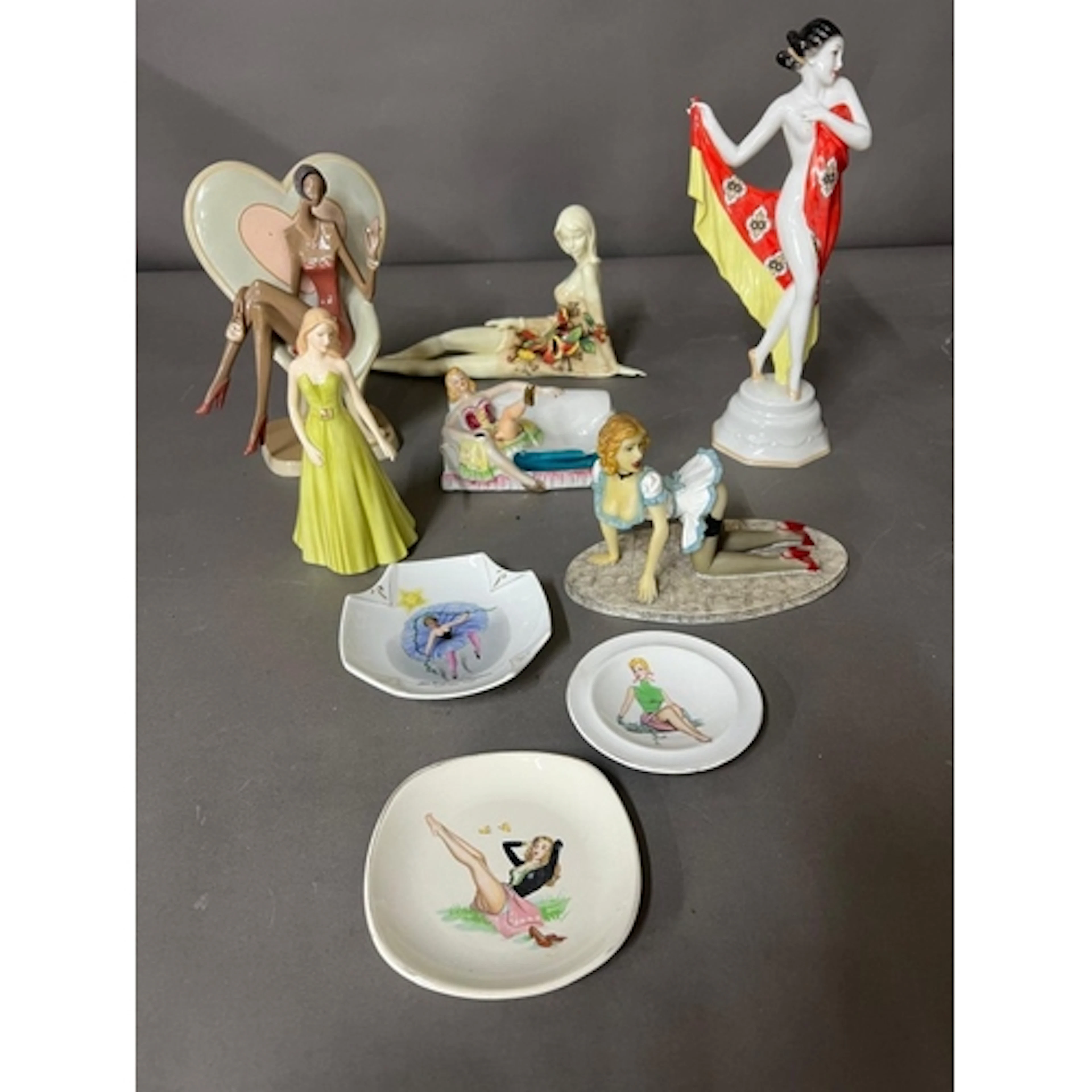 A collection of Art Deco style and erotic figures along with...