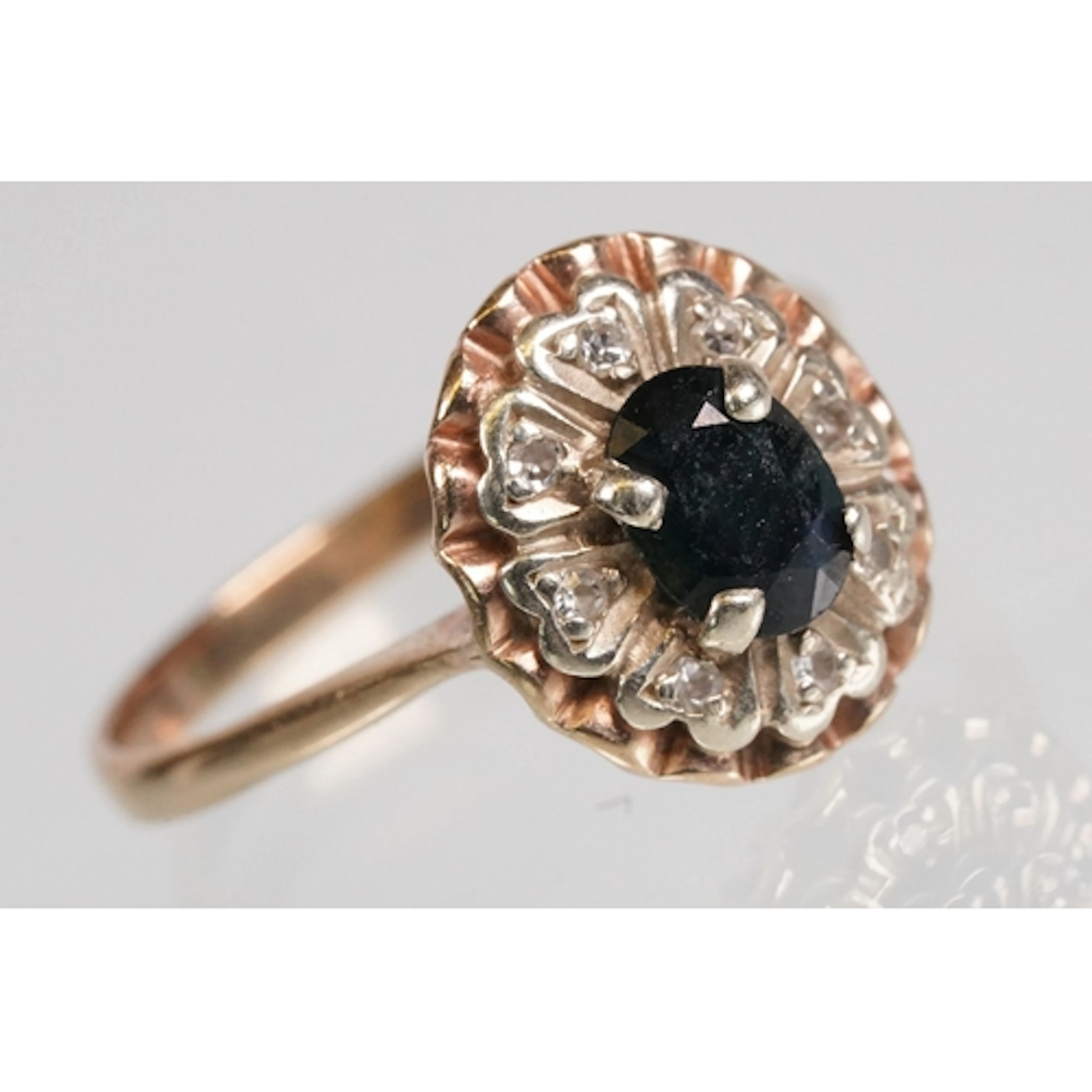 Sapphire and diamond halo ring being set with a an oval cut ...