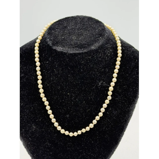 A pearl necklace with hallmarked 9ct gold clasp, approximate...