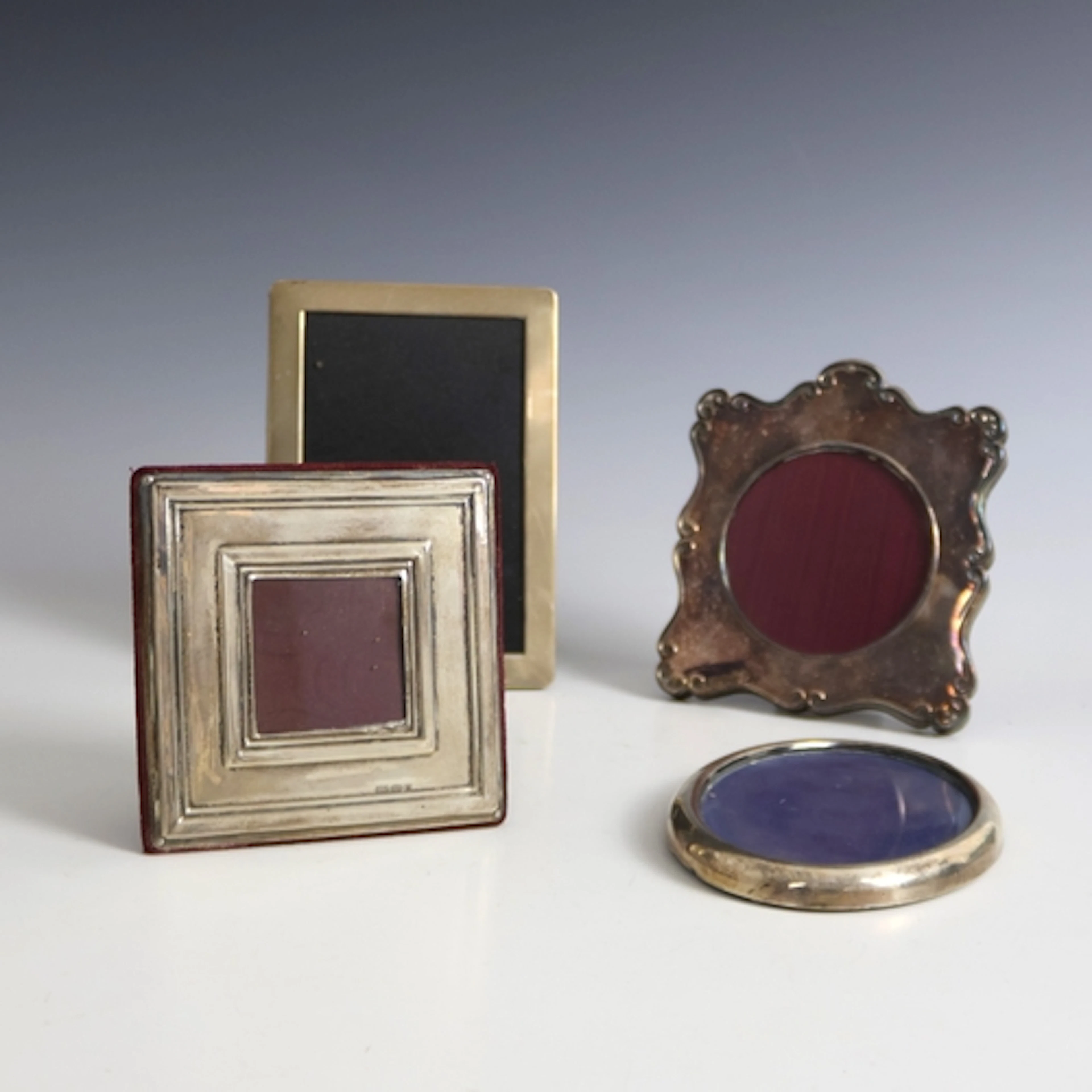 A group of four silver mounted photograph frames, including ...